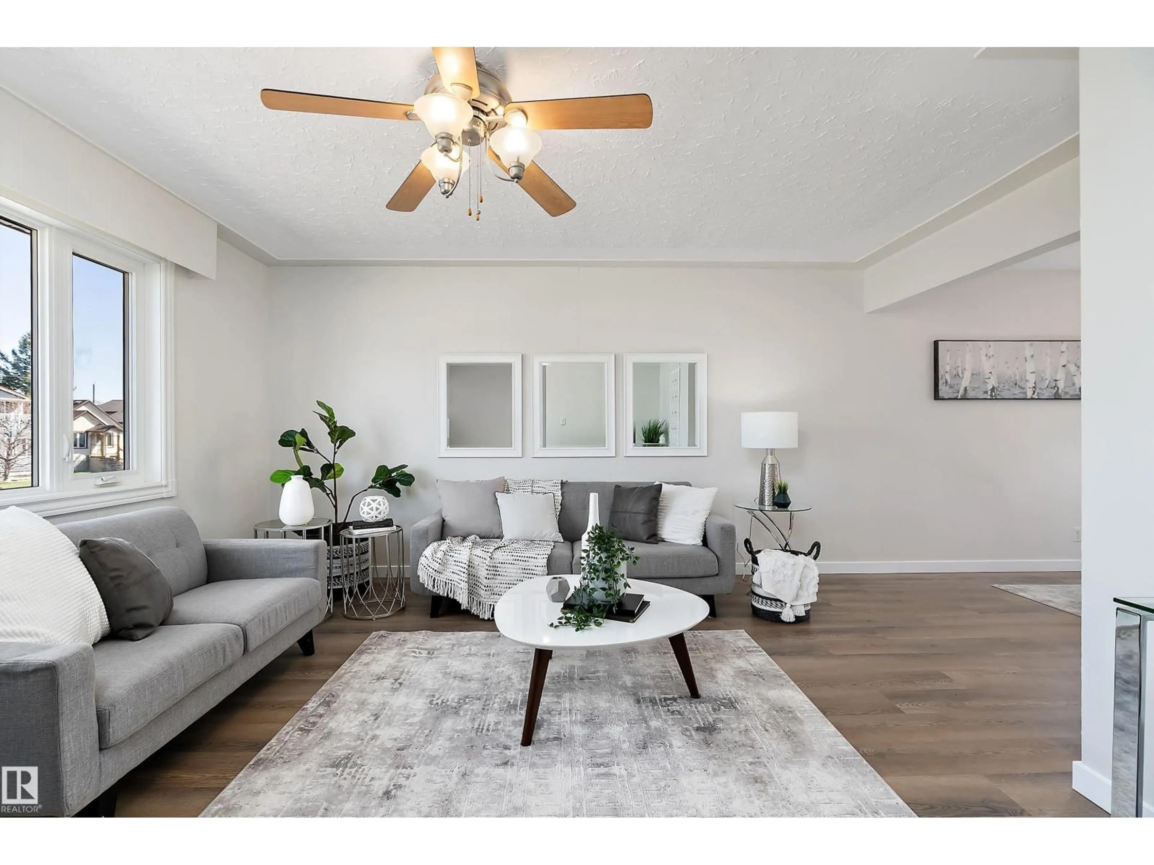 Living room with furniture, wood/laminate floor for 9747 66 AV, Edmonton Alberta T6E0M4