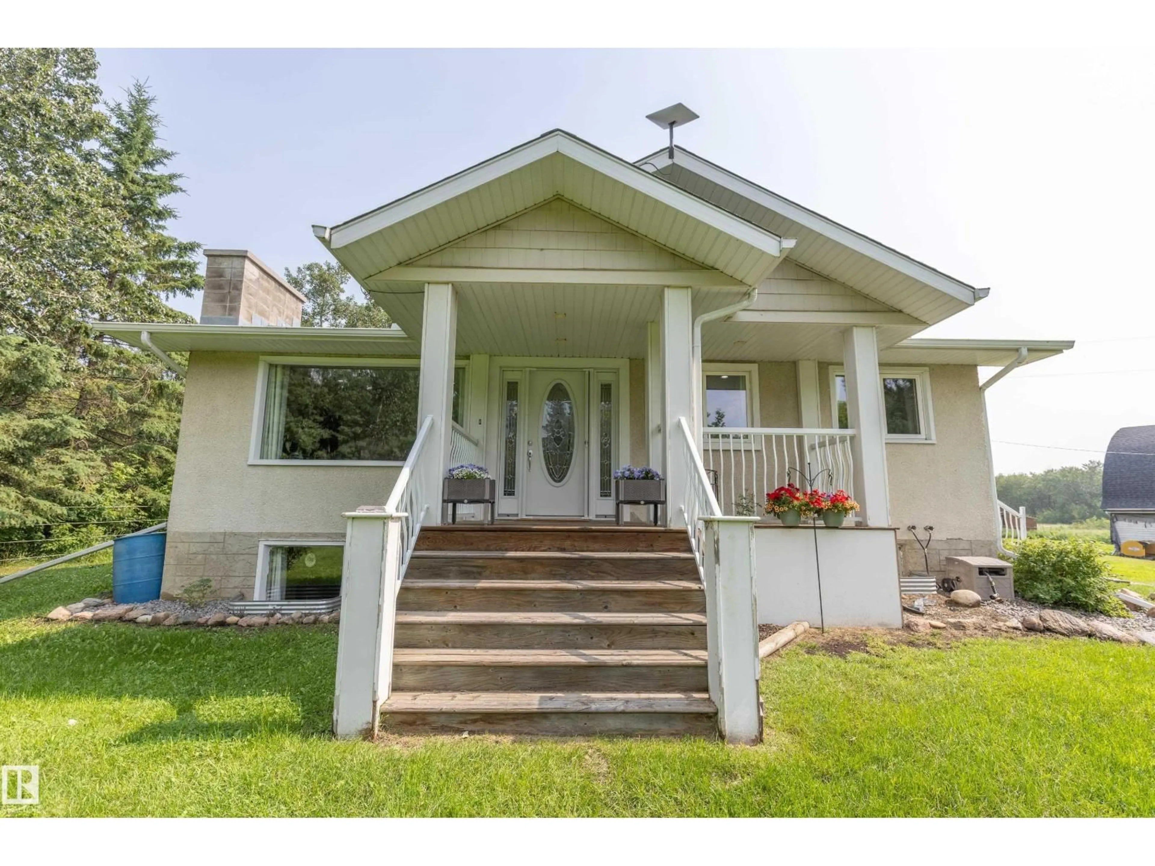 Home with vinyl exterior material, street for 191062 HWY 16, Rural Lamont County Alberta T0B4J0