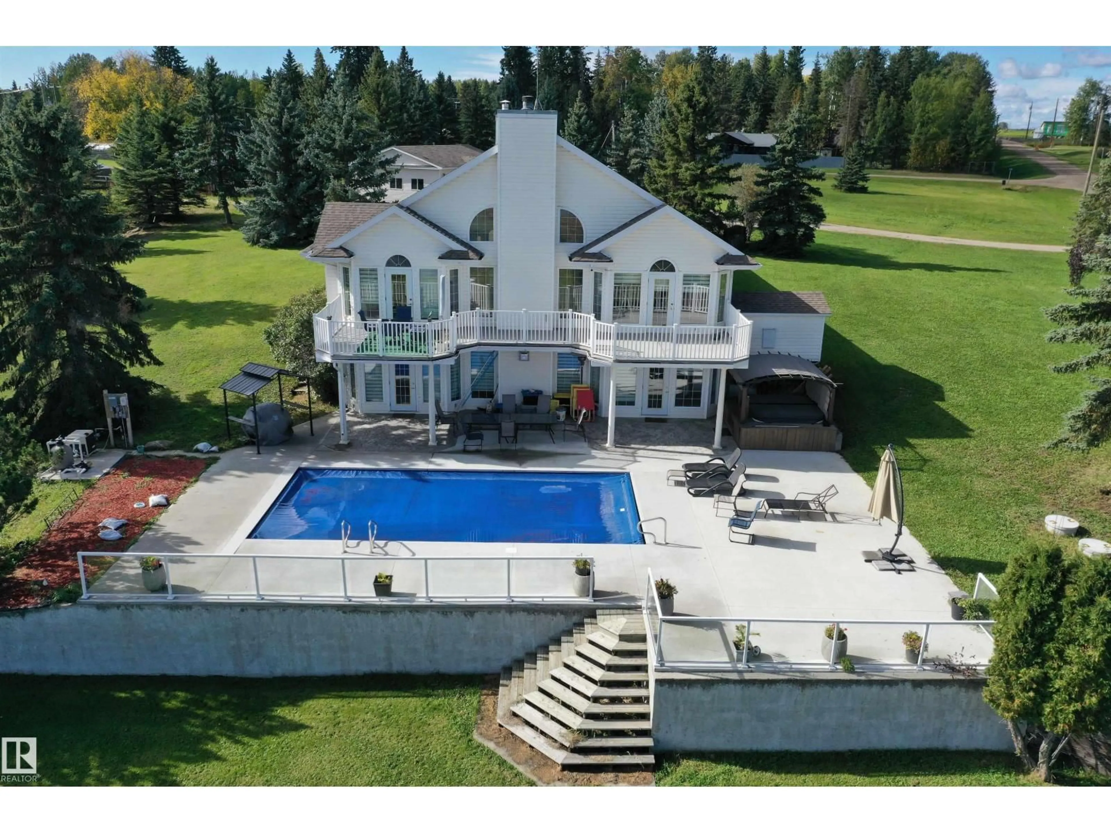 A pic from outside/outdoor area/front of a property/back of a property/a pic from drone, mountain view for 205 1 AV, Rural Wetaskiwin County Alberta T0C0T0