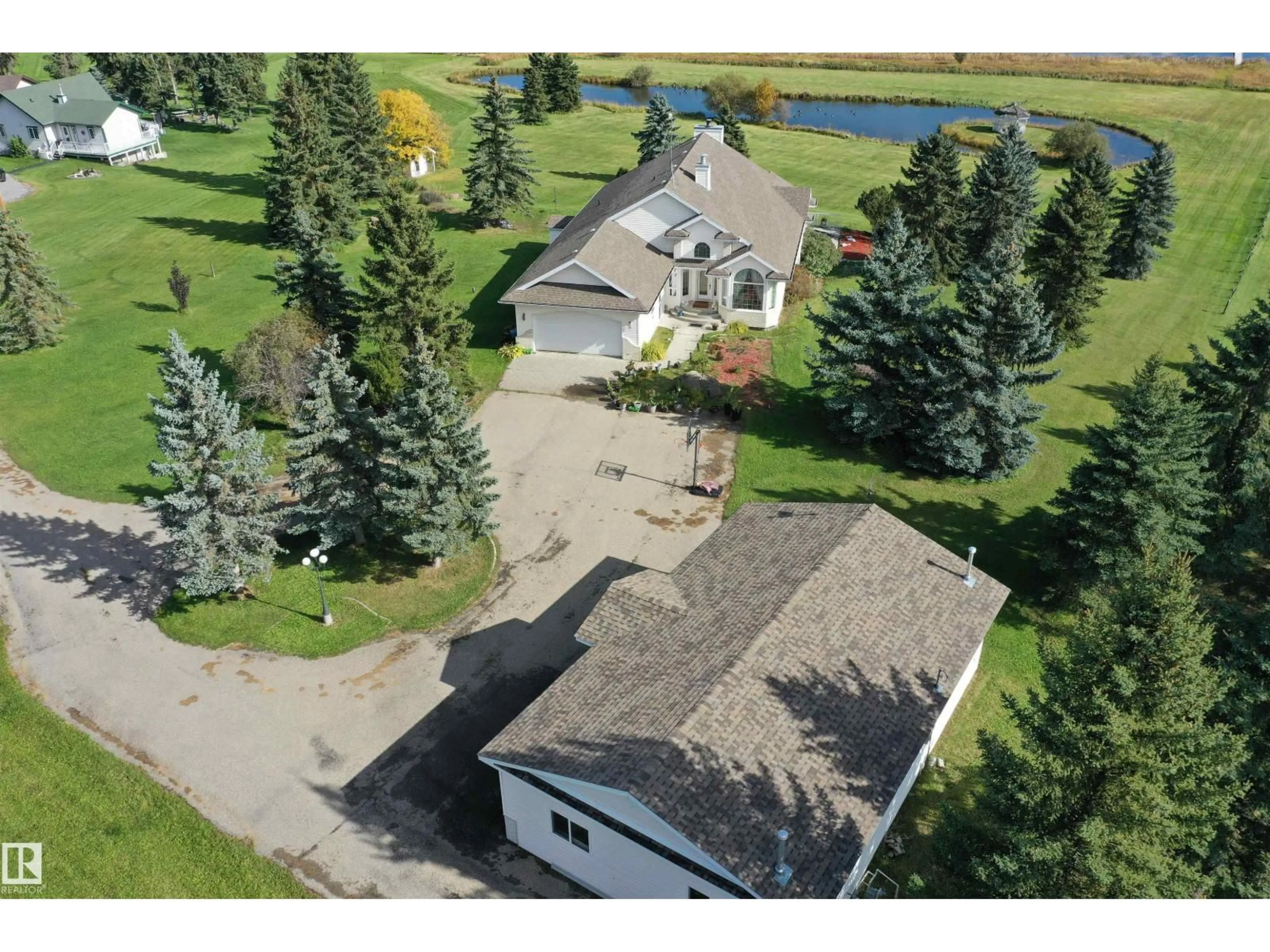 A pic from outside/outdoor area/front of a property/back of a property/a pic from drone, street for 205 1 AV, Rural Wetaskiwin County Alberta T0C0T0
