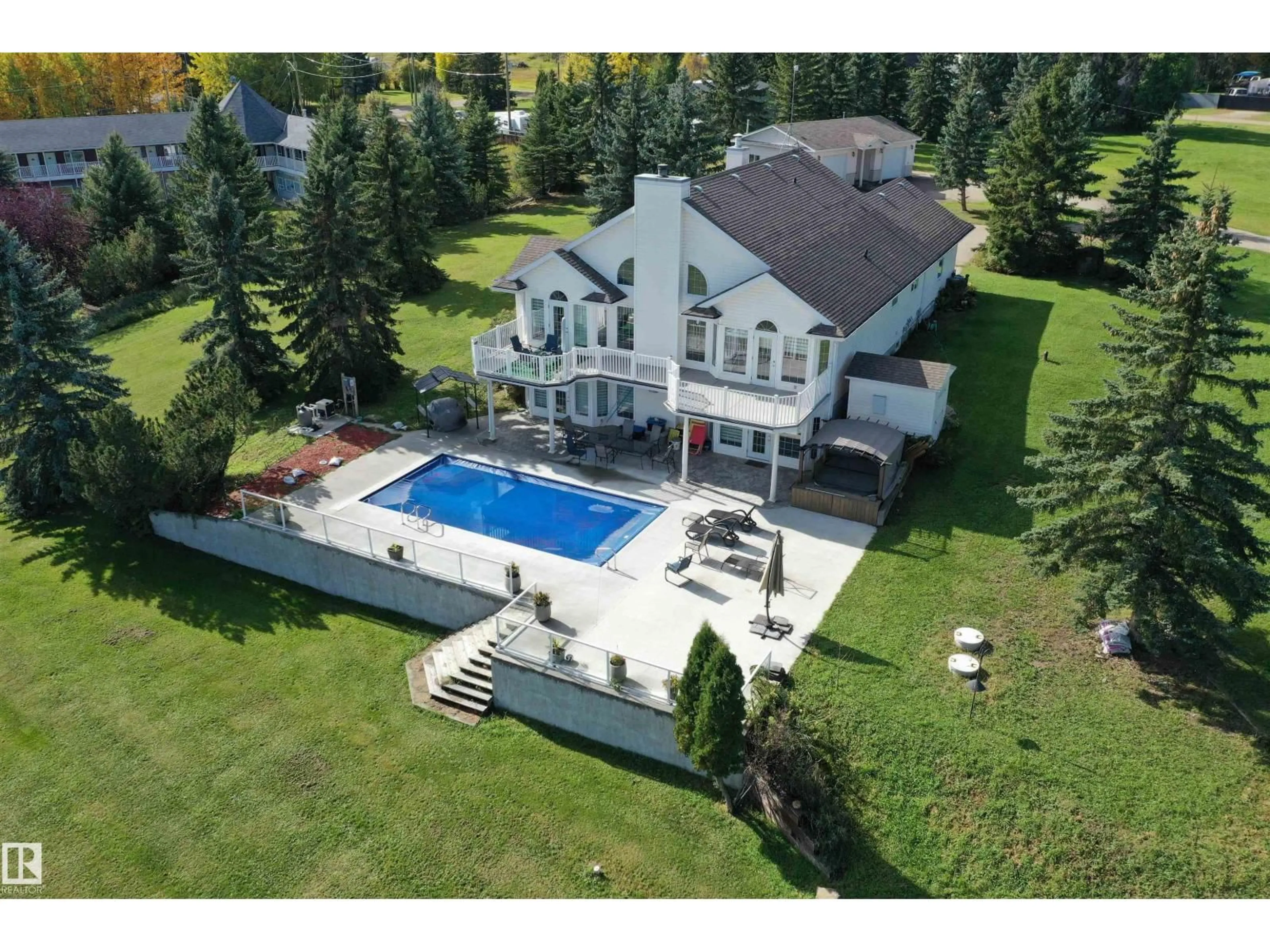 A pic from outside/outdoor area/front of a property/back of a property/a pic from drone, unknown for 205 1 AV, Rural Wetaskiwin County Alberta T0C0T0