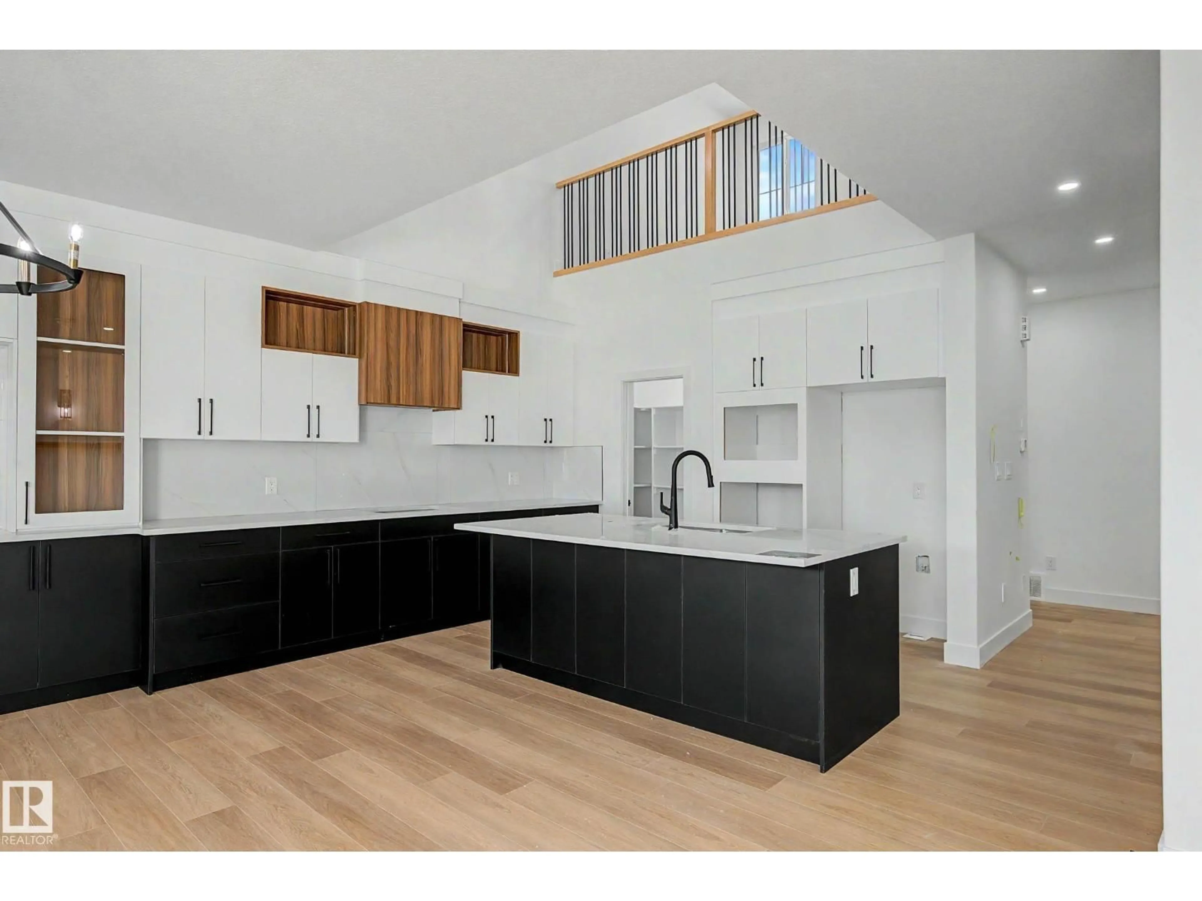 Open concept kitchen, wood/laminate floor for 294 MUNN WY, Leduc Alberta T9E0S9