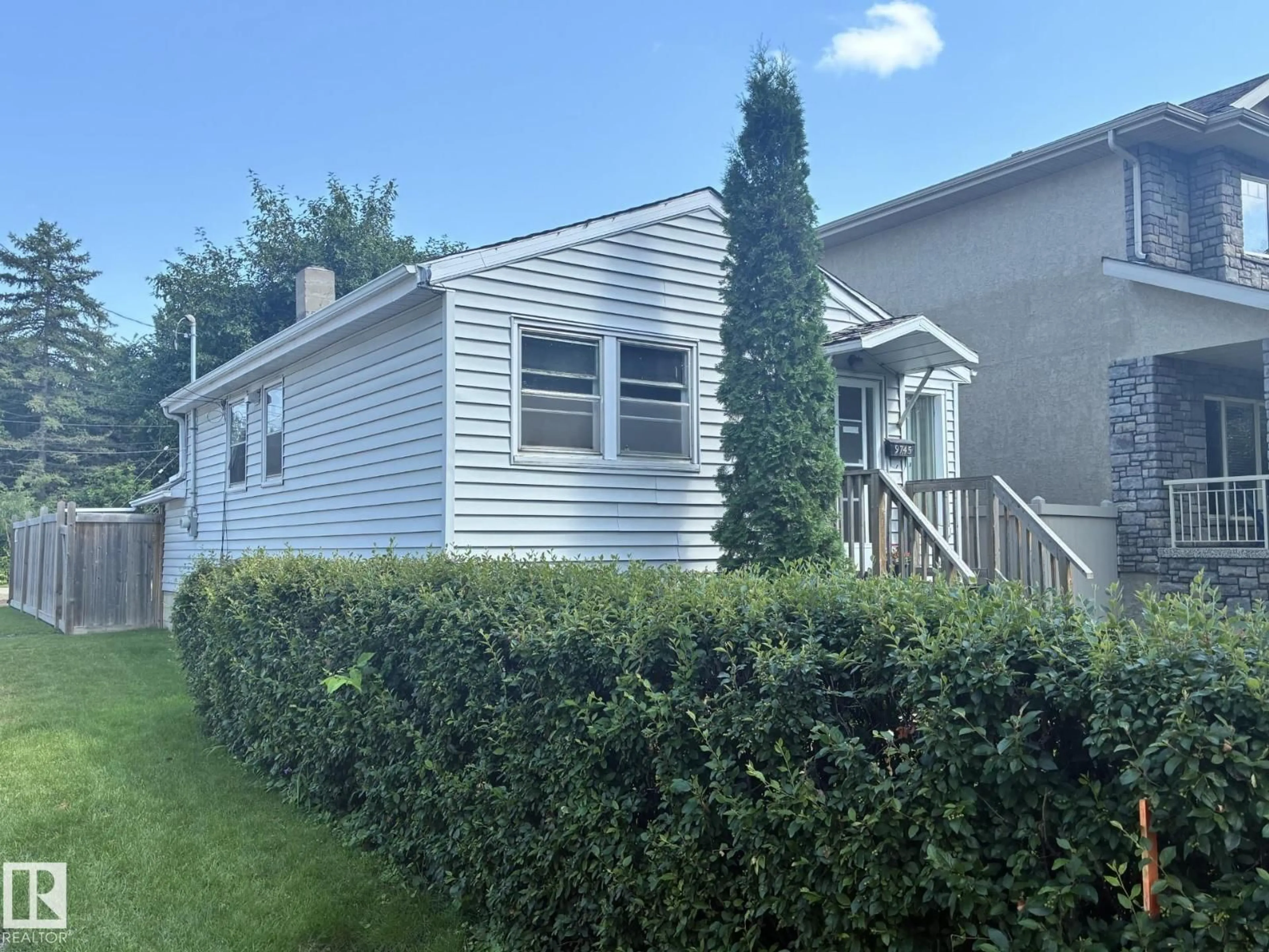 Home with vinyl exterior material, street for 9745 94 ST, Edmonton Alberta T6C3W1