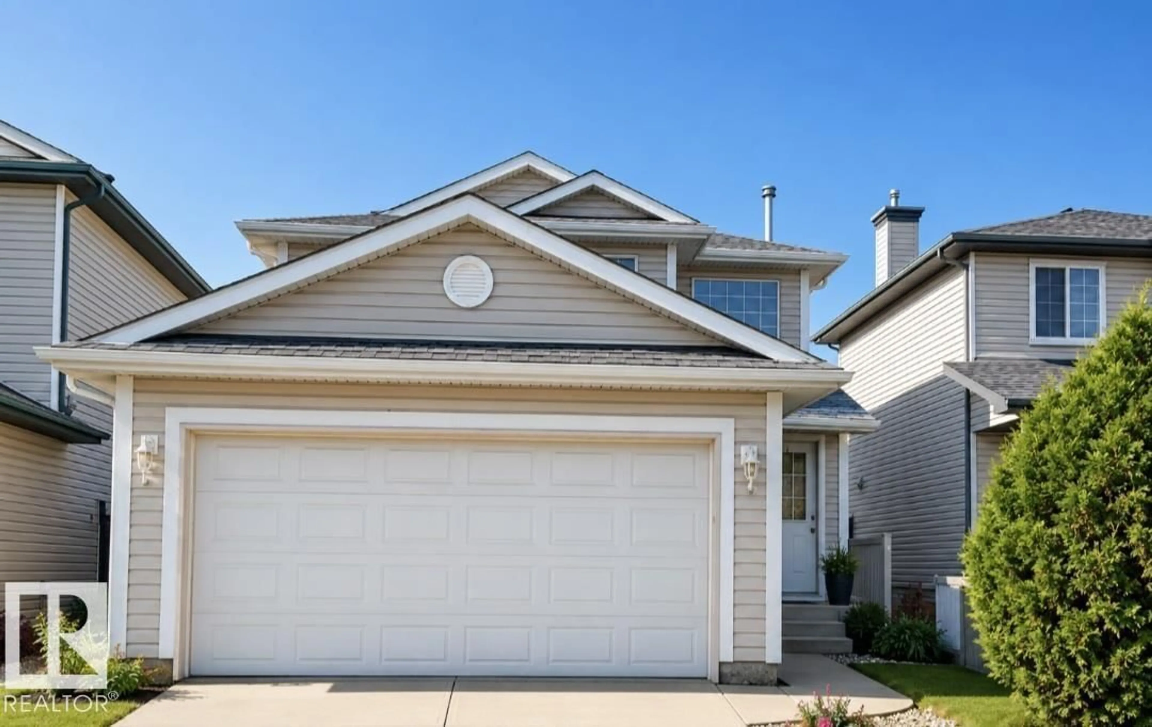 Home with vinyl exterior material, street for 3236 27 AV, Edmonton Alberta T6T1P8