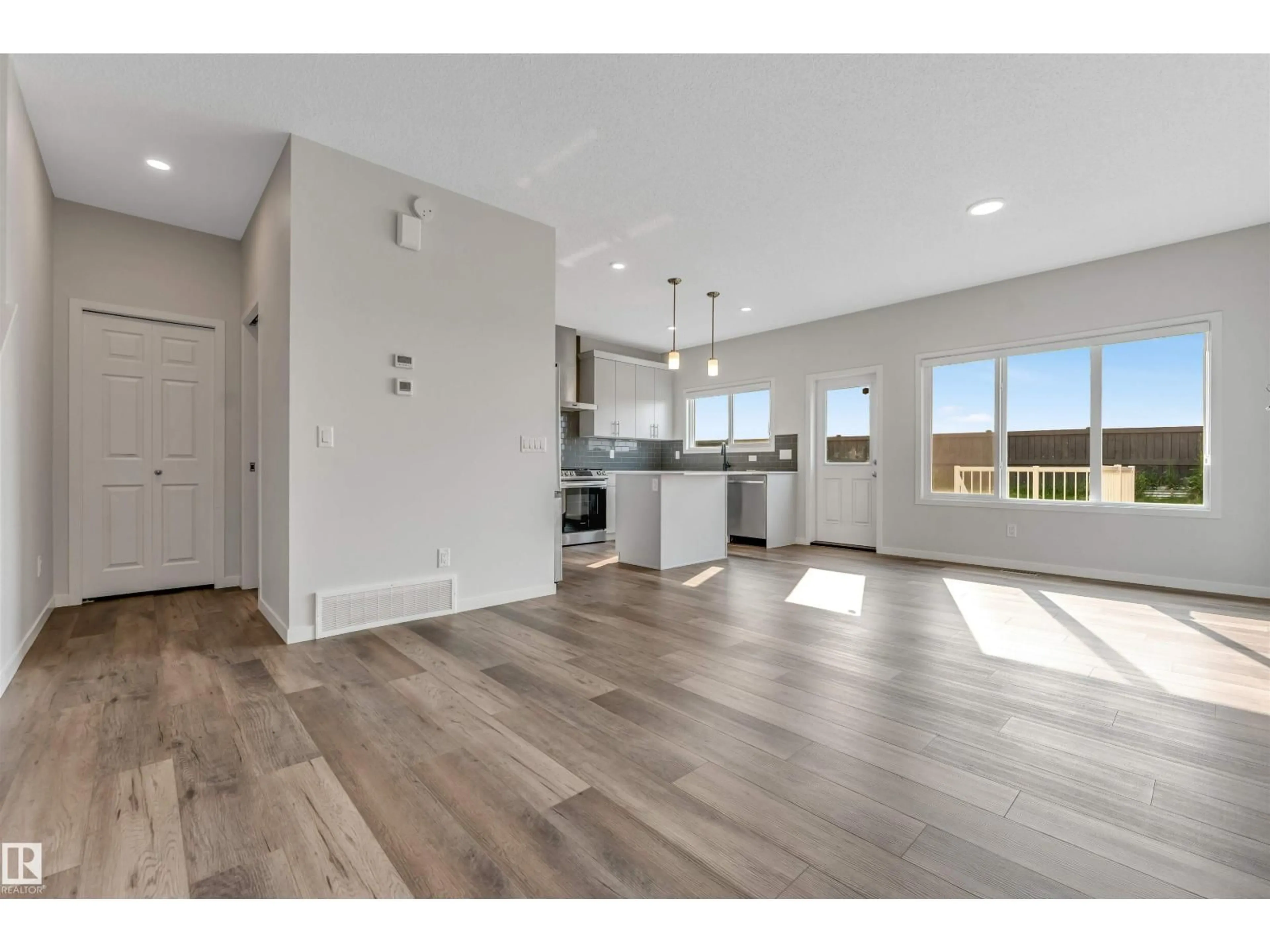 Open concept kitchen, wood/laminate floor for 17636 49 ST NW, Edmonton Alberta T5Y3Y1