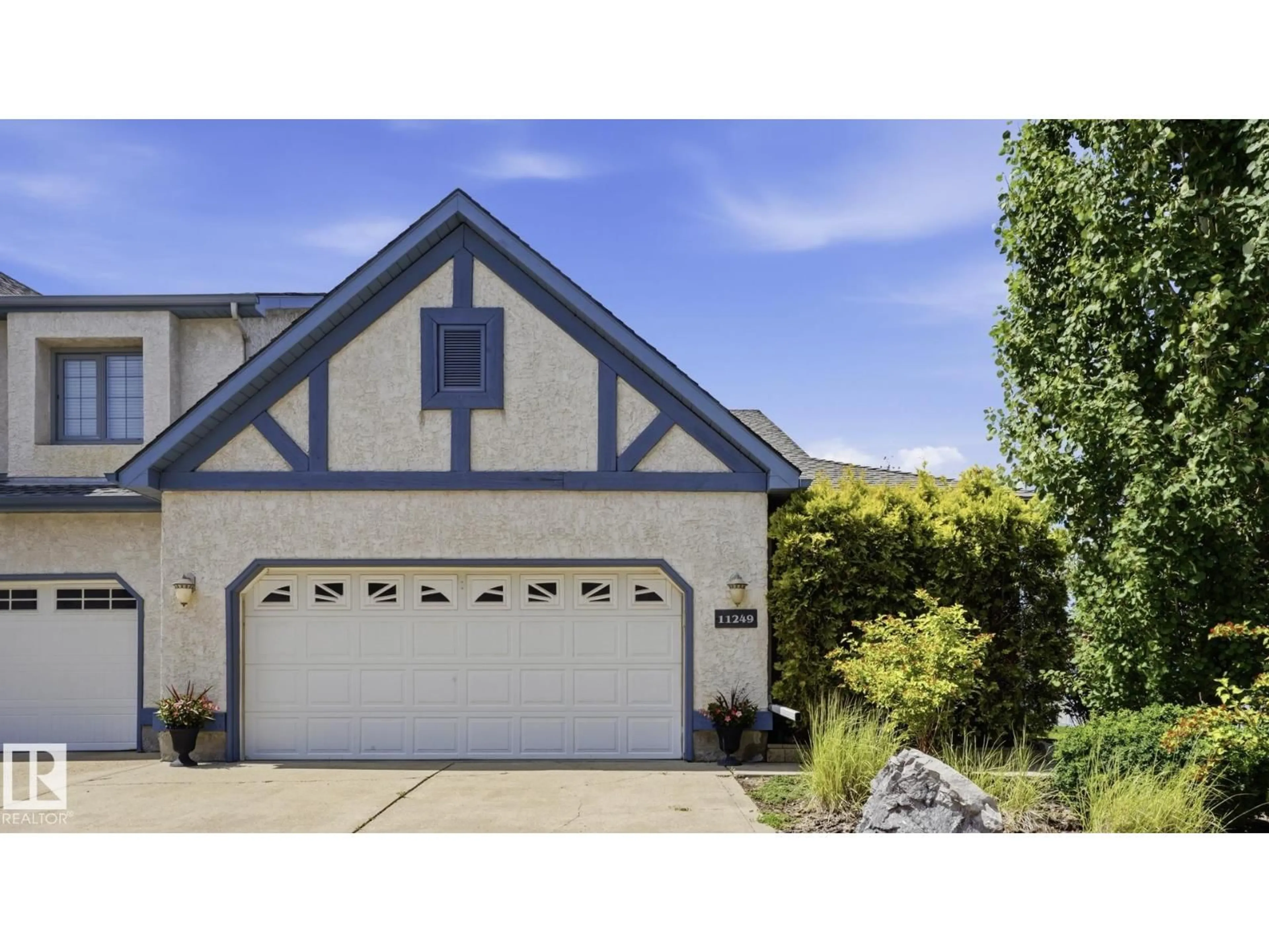 Home with vinyl exterior material, street for 10 11249 12 AV, Edmonton Alberta T6J6V6