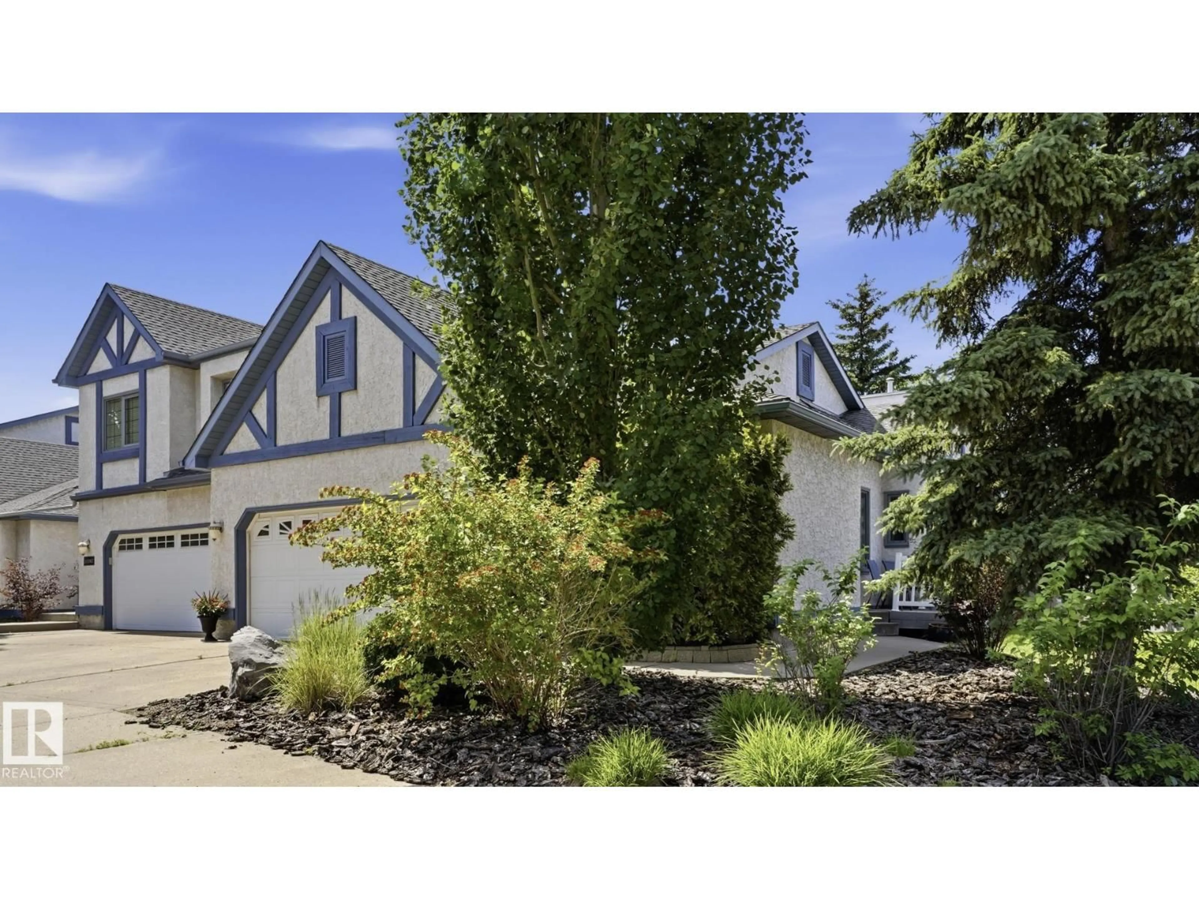 Home with vinyl exterior material, street for 10 11249 12 AV, Edmonton Alberta T6J6V6