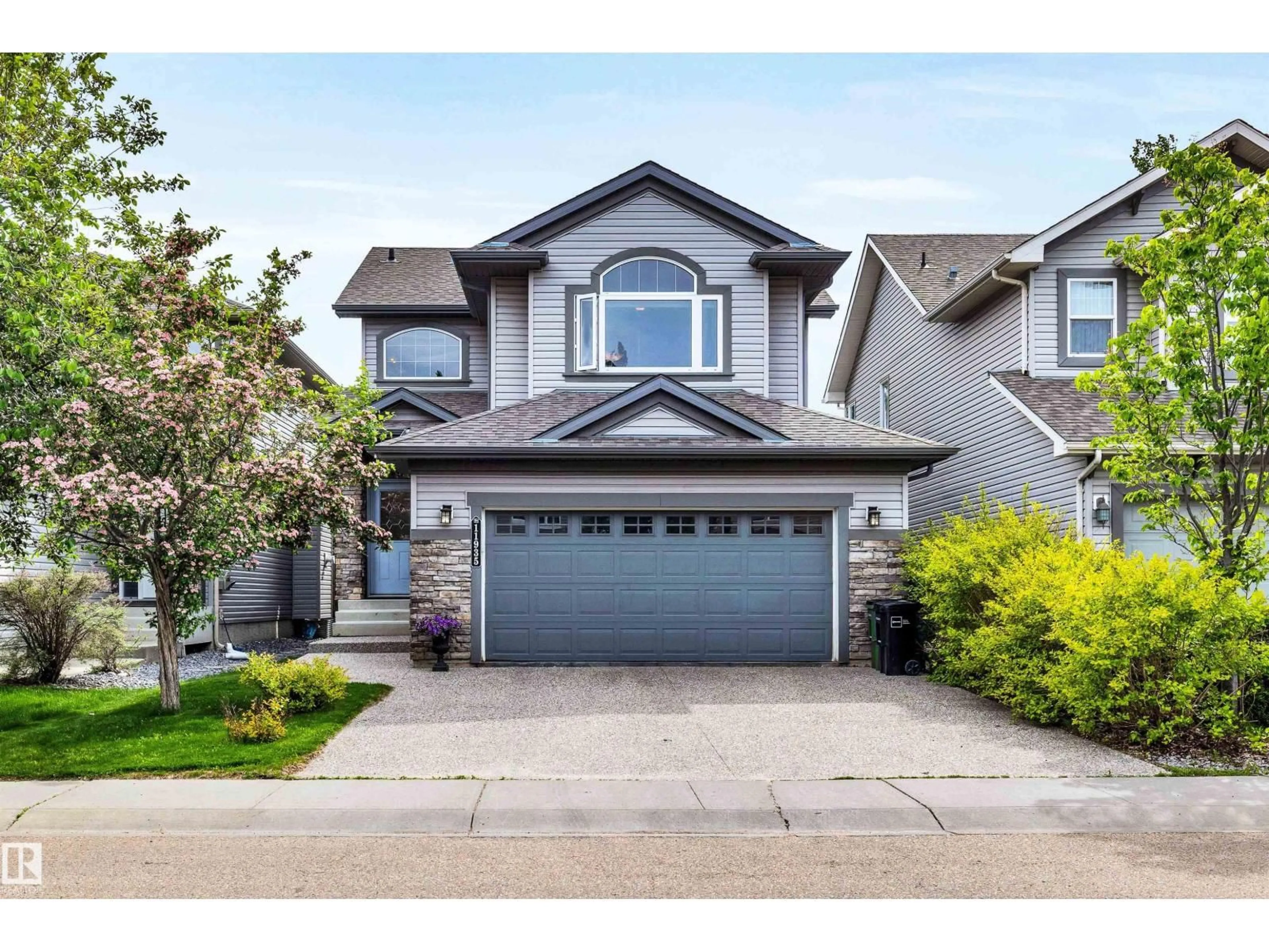 Home with vinyl exterior material, street for SW - 11935 21 AV, Edmonton Alberta T6W0C8