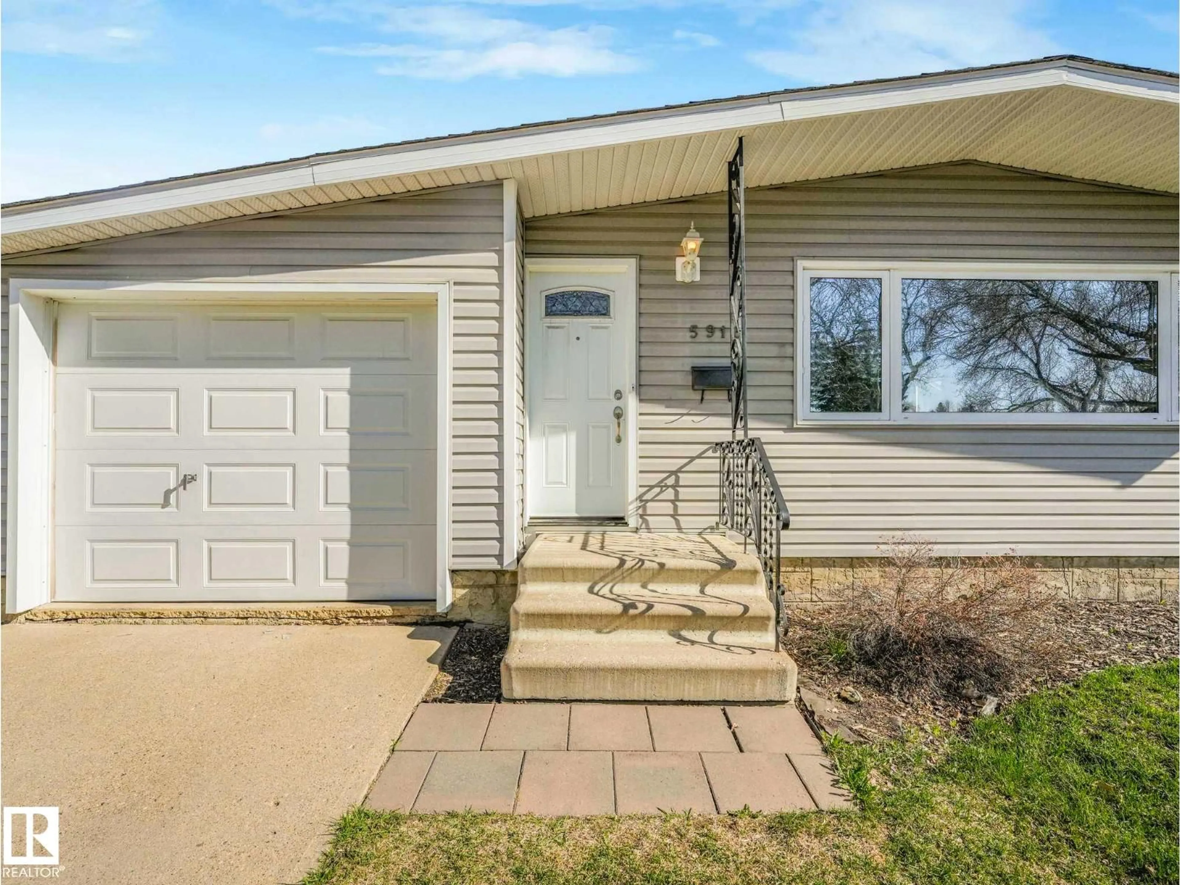 Home with vinyl exterior material, street for 5916 148 AV, Edmonton Alberta T5A1T9