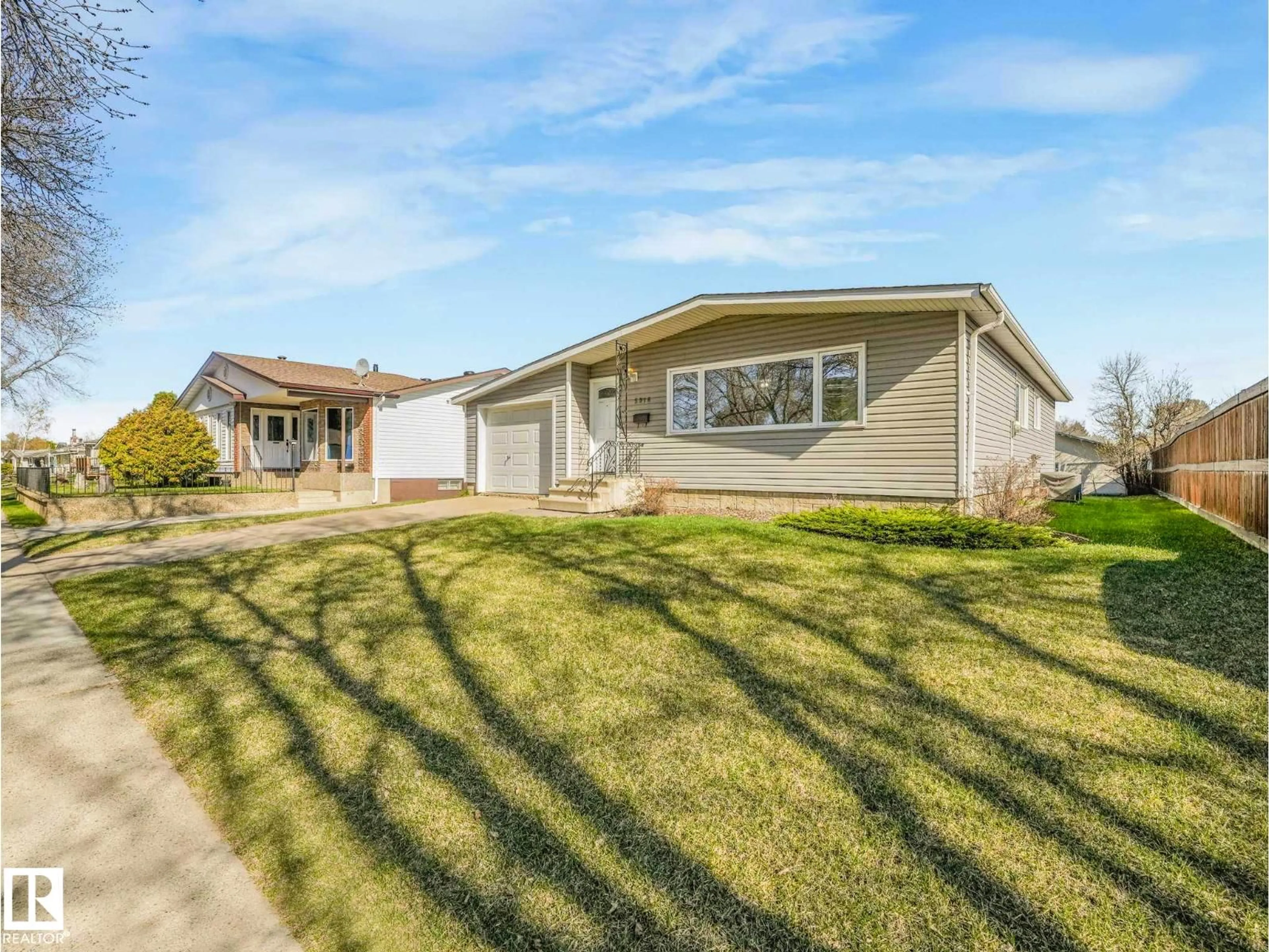 Home with vinyl exterior material, street for 5916 148 AV, Edmonton Alberta T5A1T9