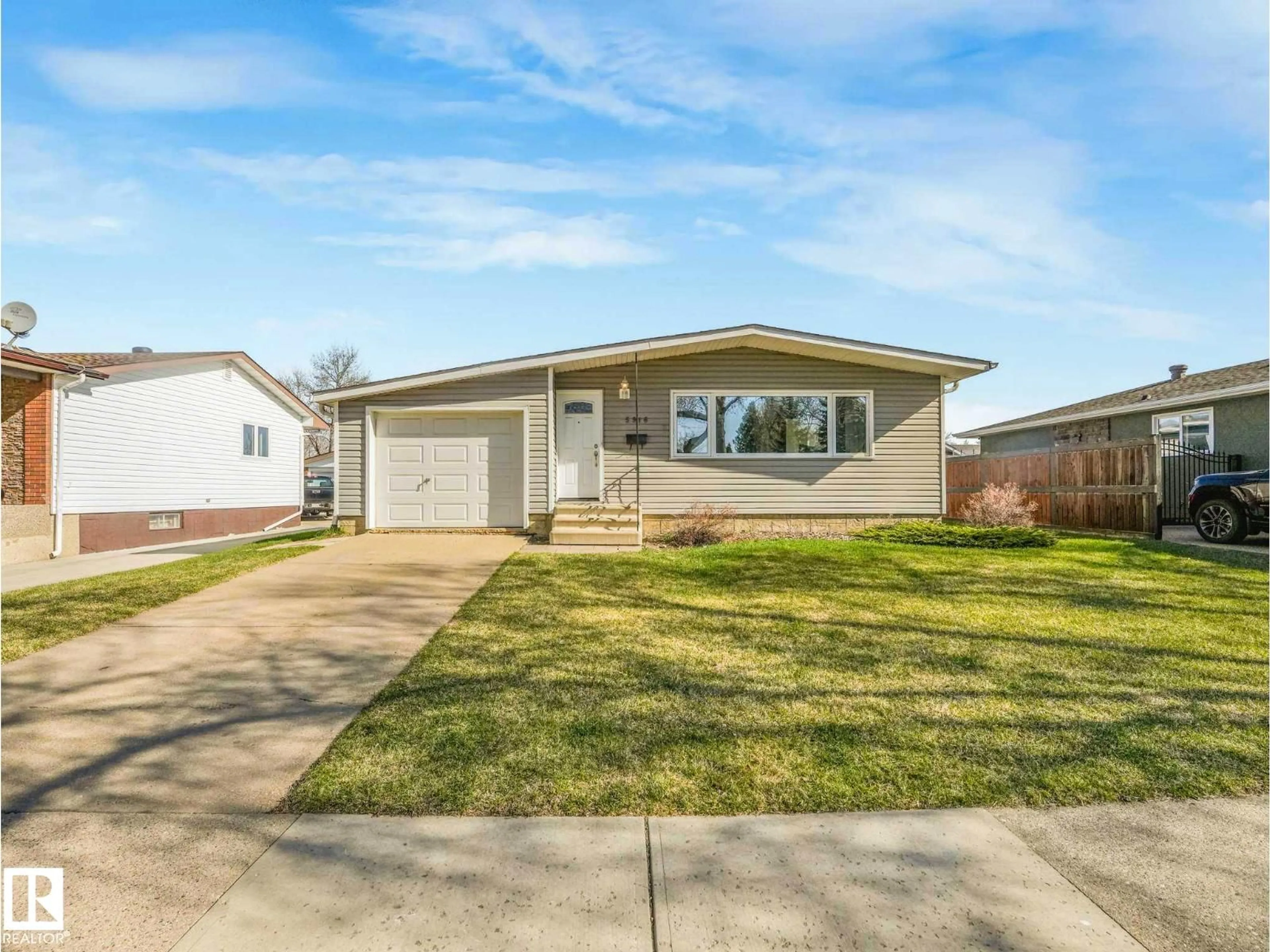 Home with vinyl exterior material, street for 5916 148 AV, Edmonton Alberta T5A1T9