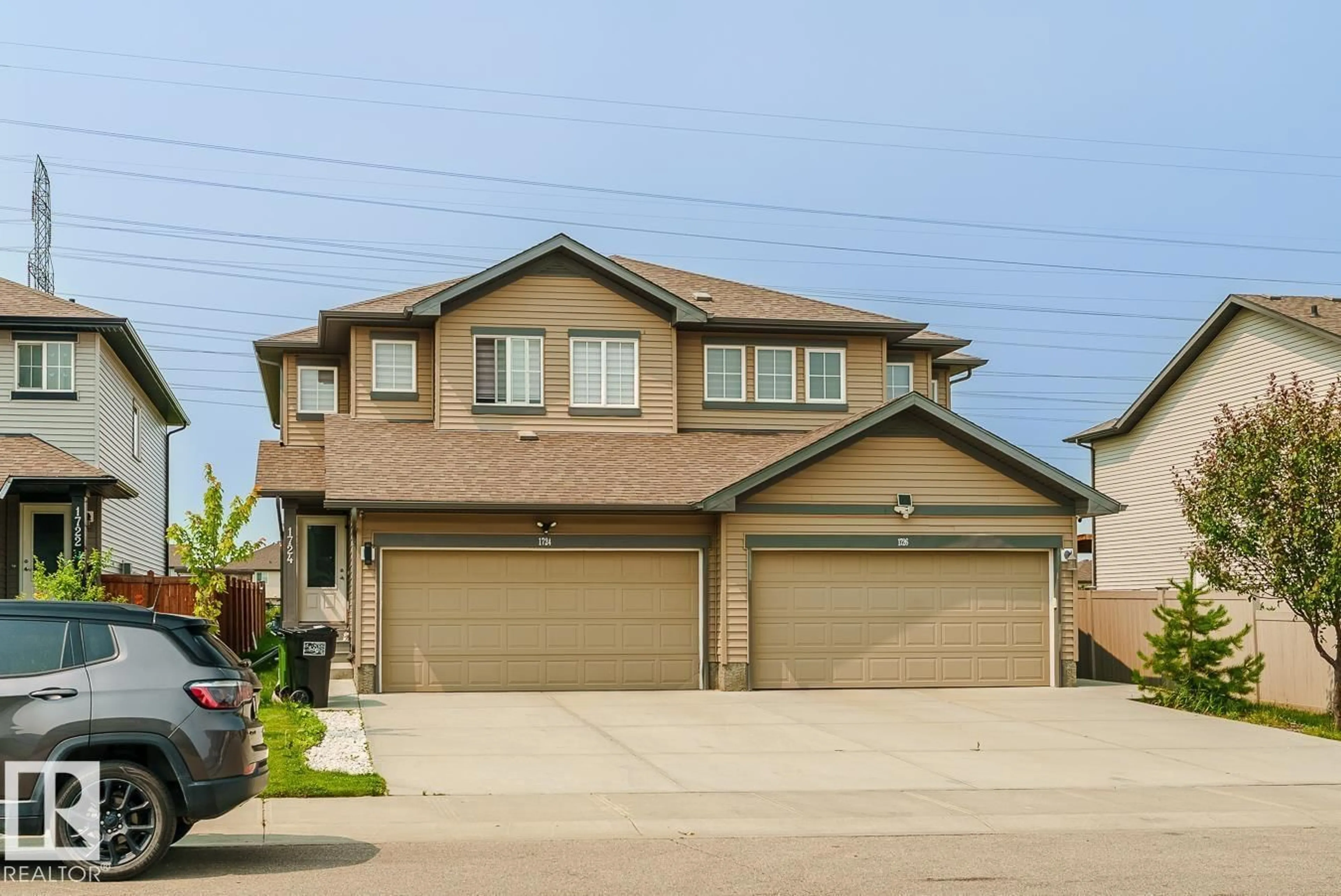 Home with vinyl exterior material, street for 1724 27 ST, Edmonton Alberta T6T2G6