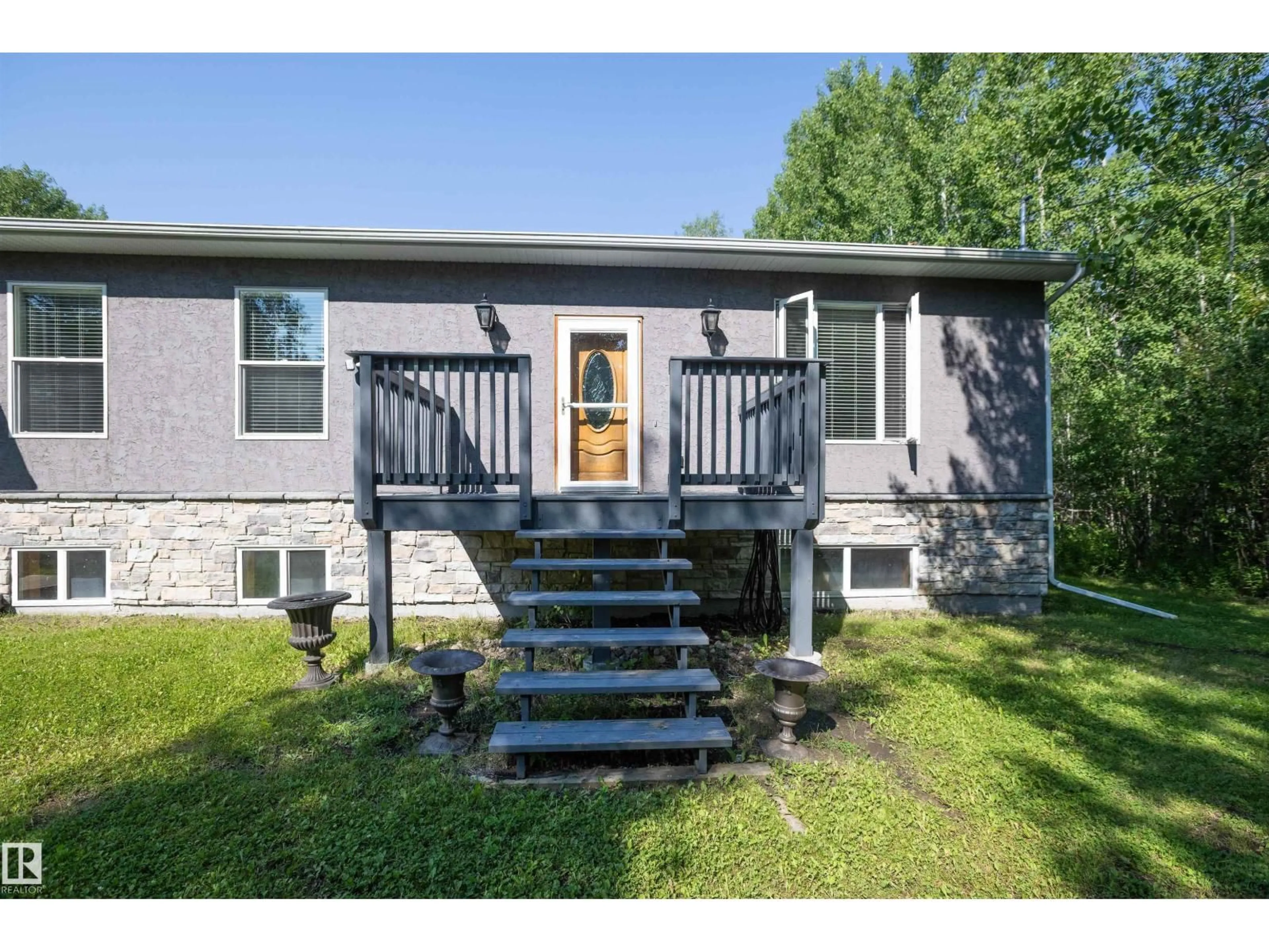 Home with vinyl exterior material, street for 204 - 57312 RGE RD, Rural Barrhead County Alberta T0E1A0