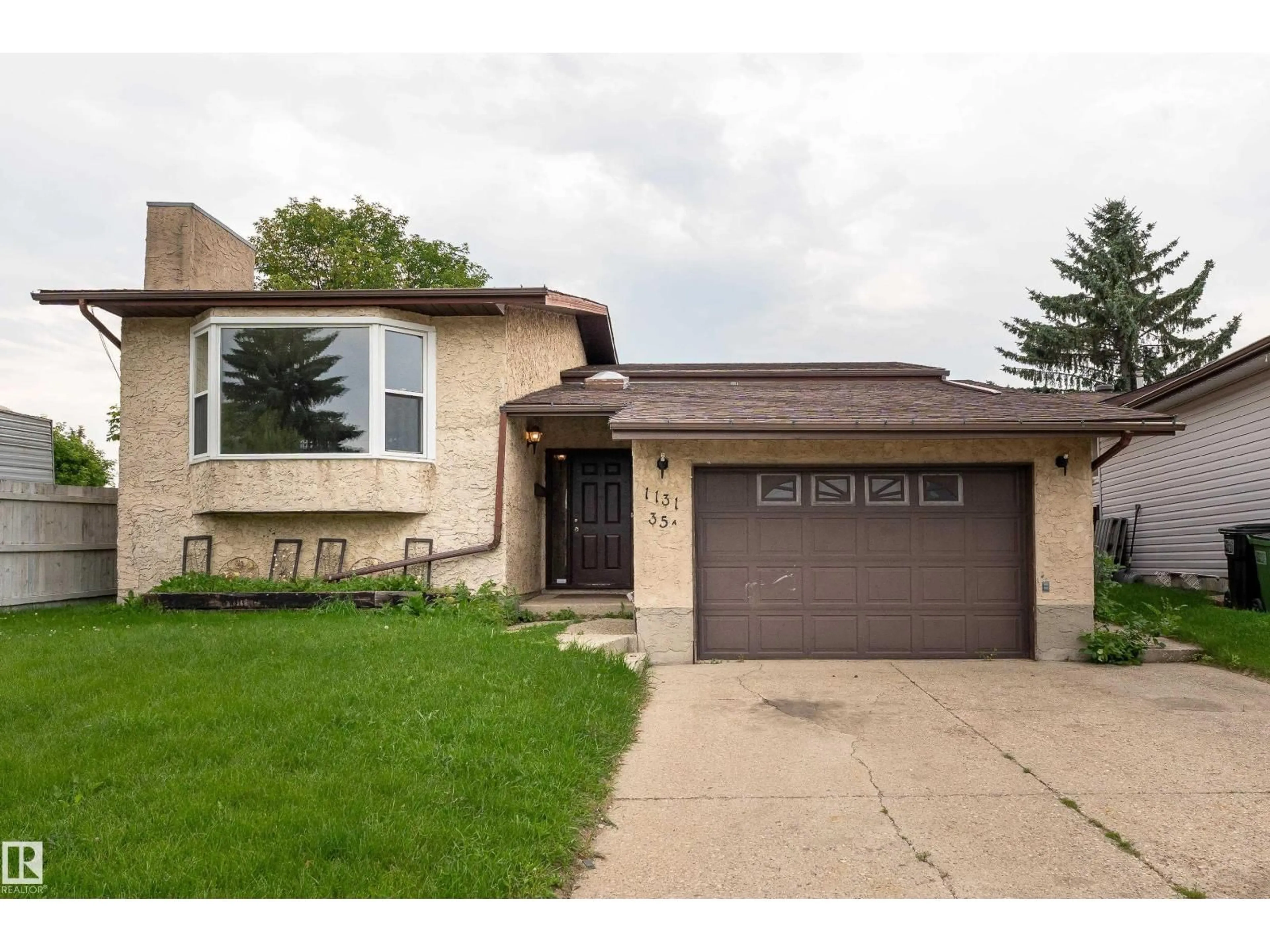Home with brick exterior material, street for NW - 1131 35A ST, Edmonton Alberta T6L2L4