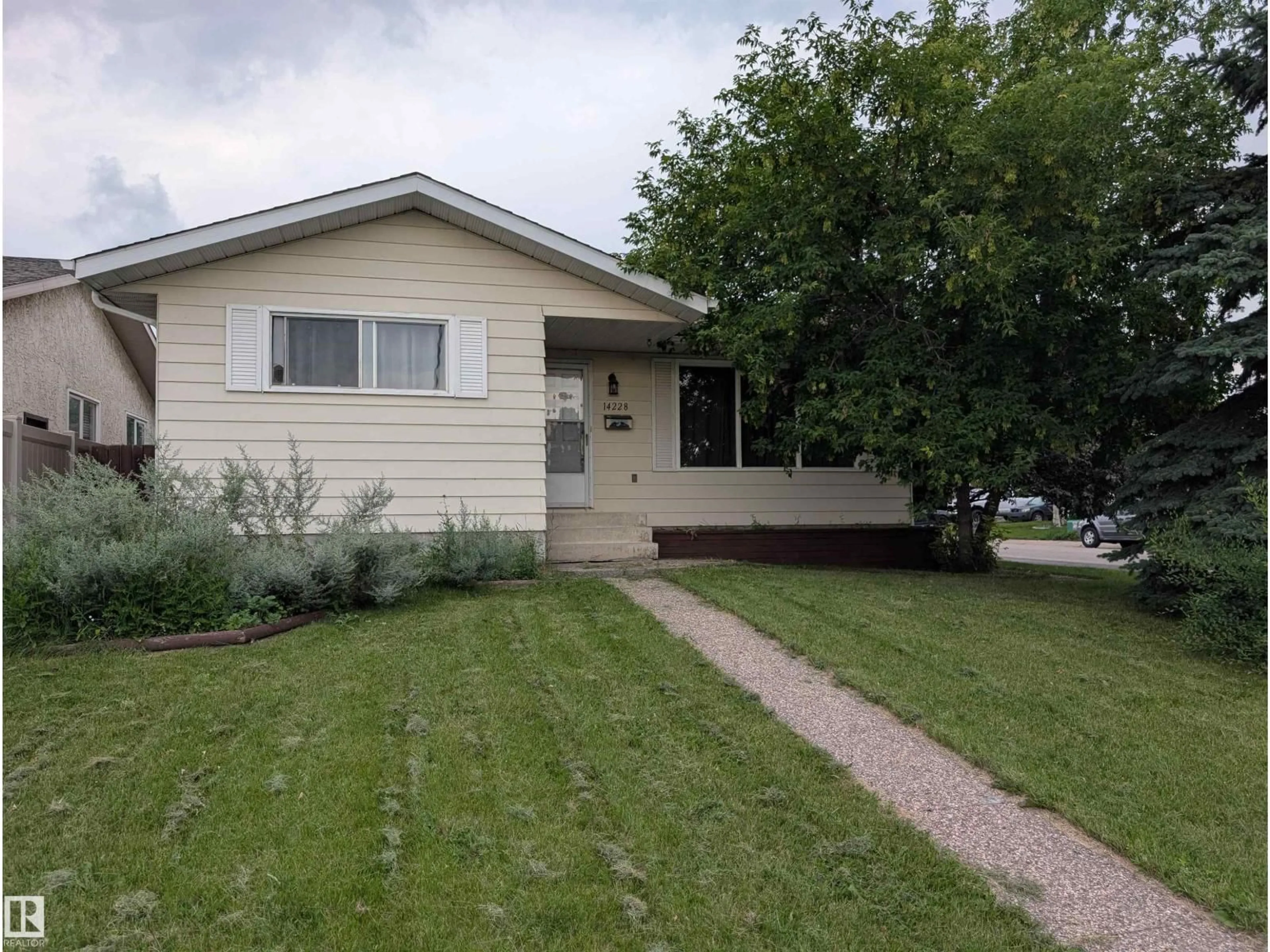 Home with vinyl exterior material, street for NW - 14228 22 ST, Edmonton Alberta T5Y1E5