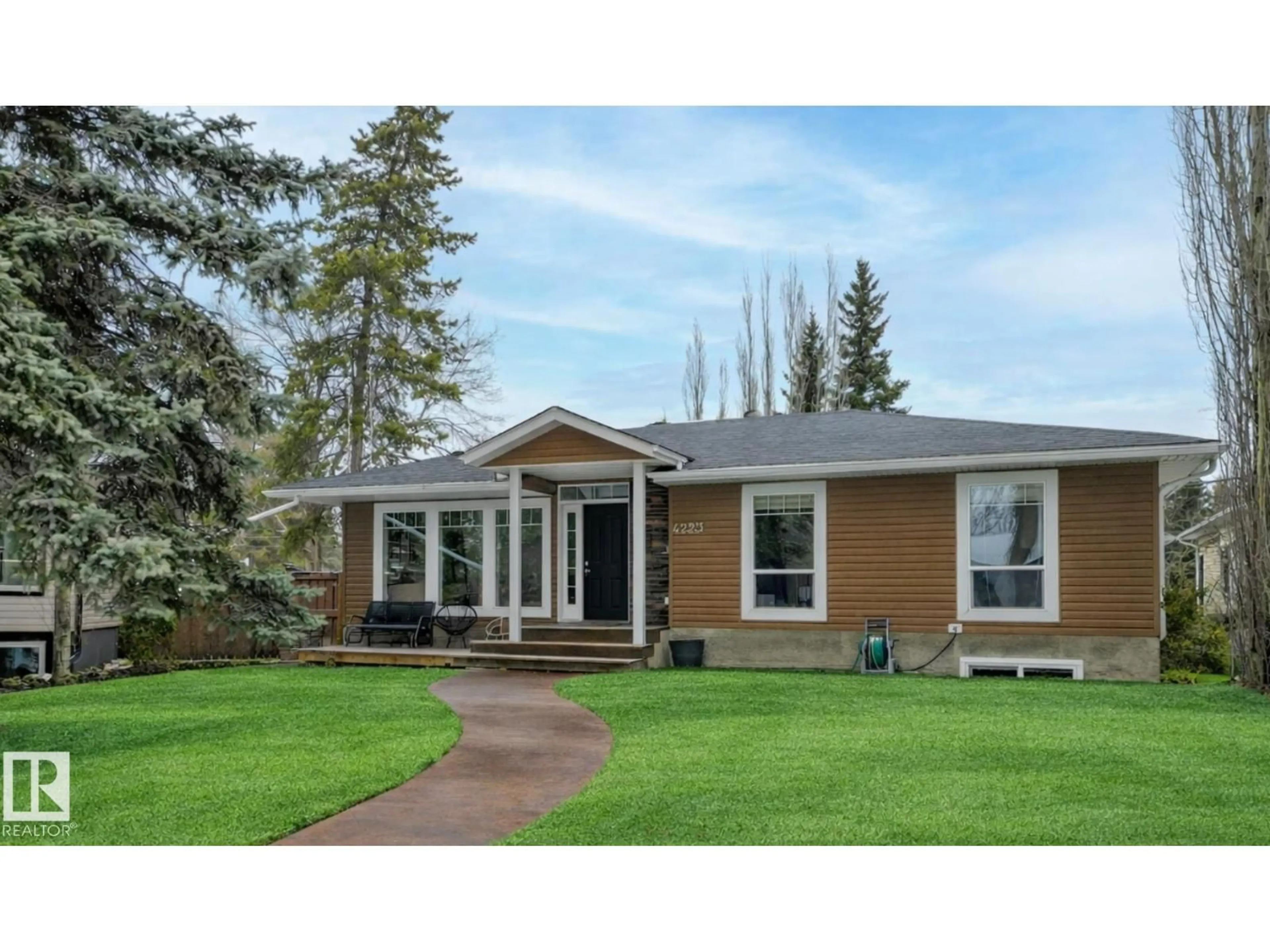 Home with vinyl exterior material, street for 4223 120 ST, Edmonton Alberta T6J1X9