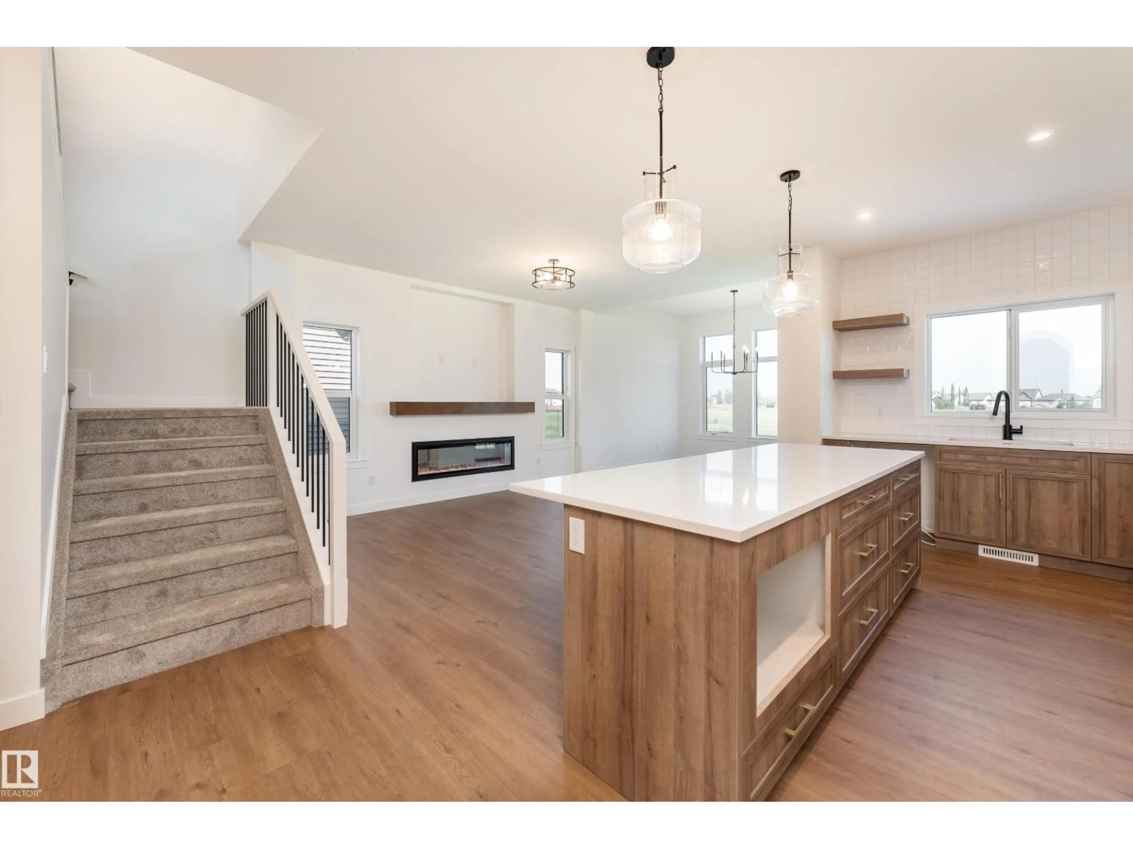 Open concept kitchen, wood/laminate floor for 18 TENUTO LI, Spruce Grove Alberta T7X3M7