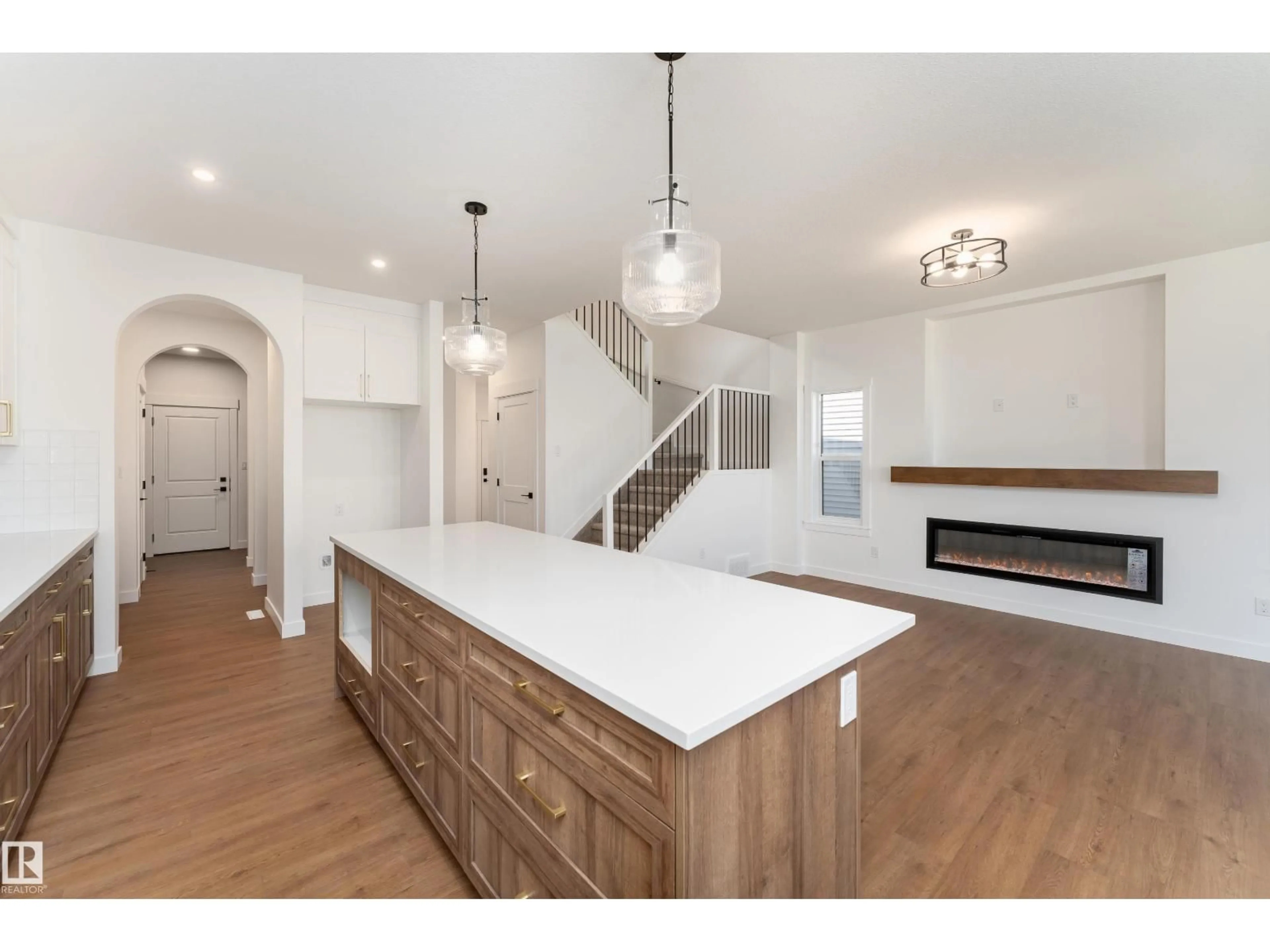 Open concept kitchen, wood/laminate floor for 18 TENUTO LI, Spruce Grove Alberta T7X3M7