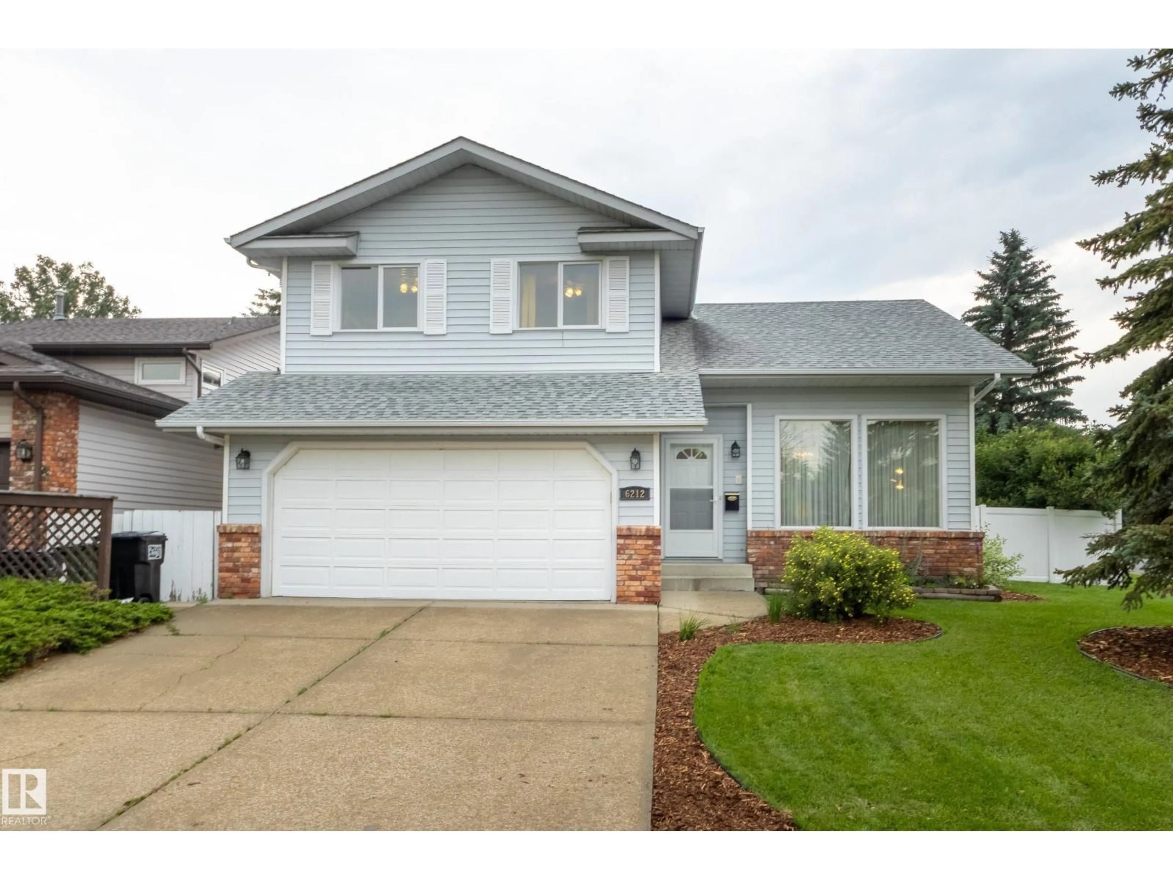 Home with vinyl exterior material, street for NW - 6212 179 ST, Edmonton Alberta T5T4E4
