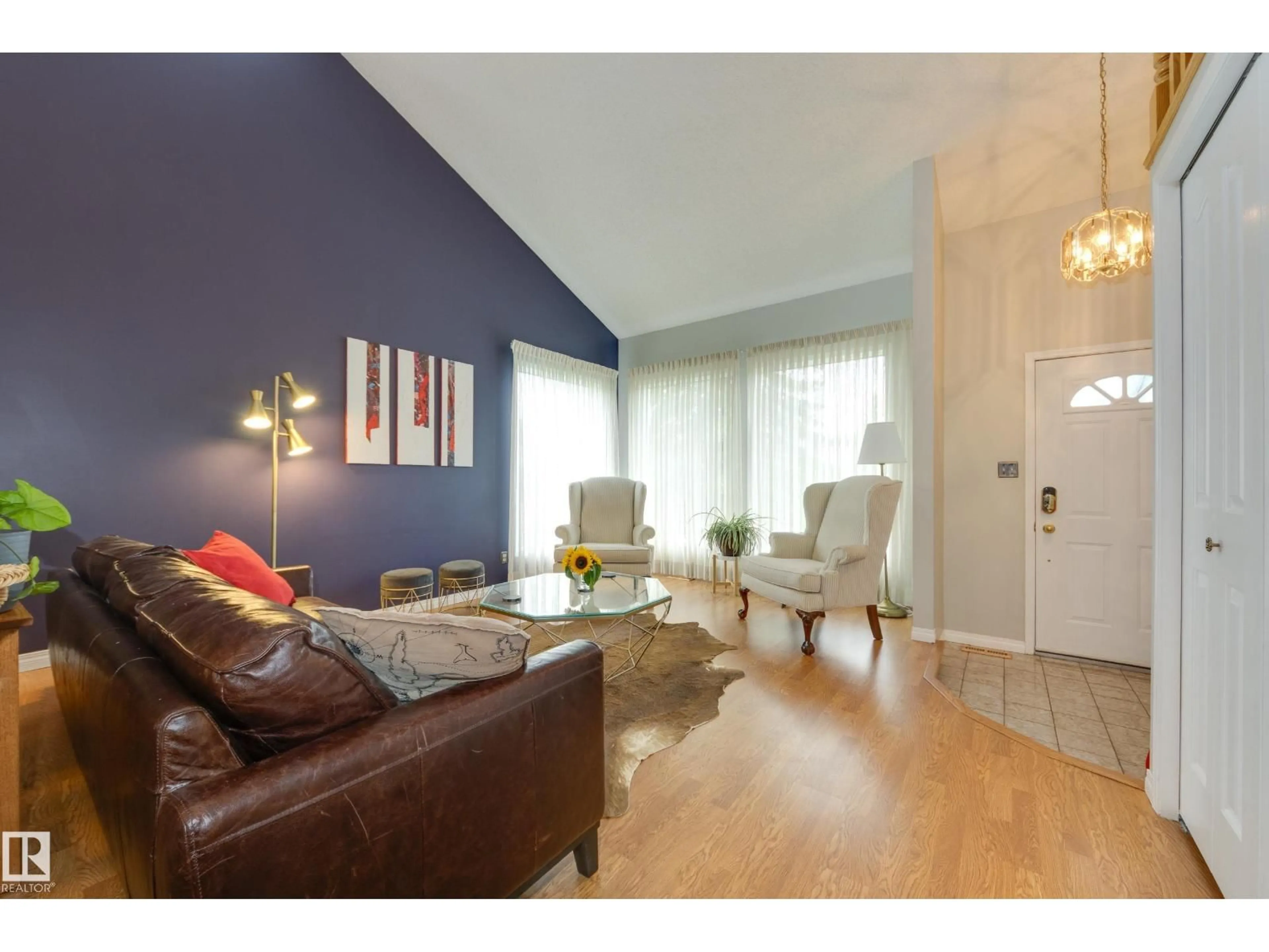 Living room with furniture, wood/laminate floor for NW - 6212 179 ST, Edmonton Alberta T5T4E4