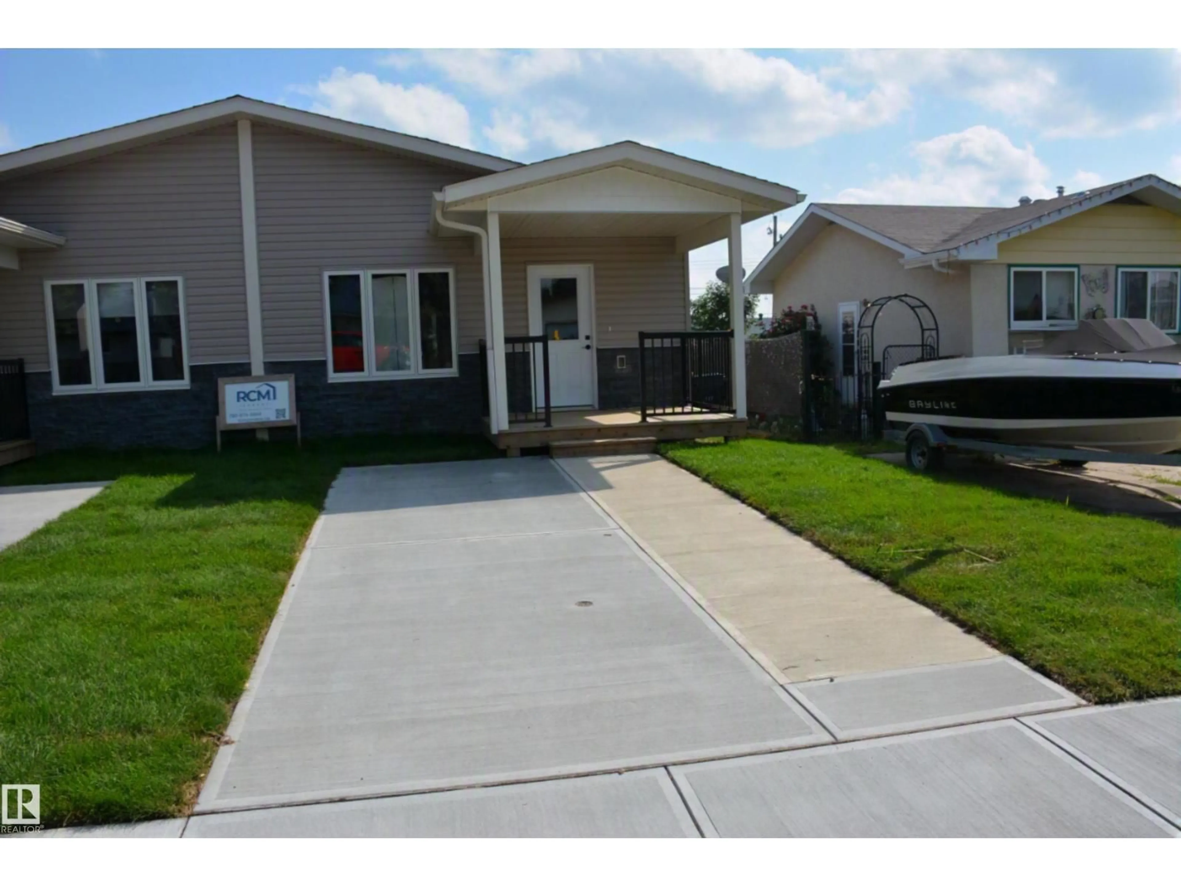Home with vinyl exterior material, street for 4313 54 AV, Barrhead Alberta T7N1J8