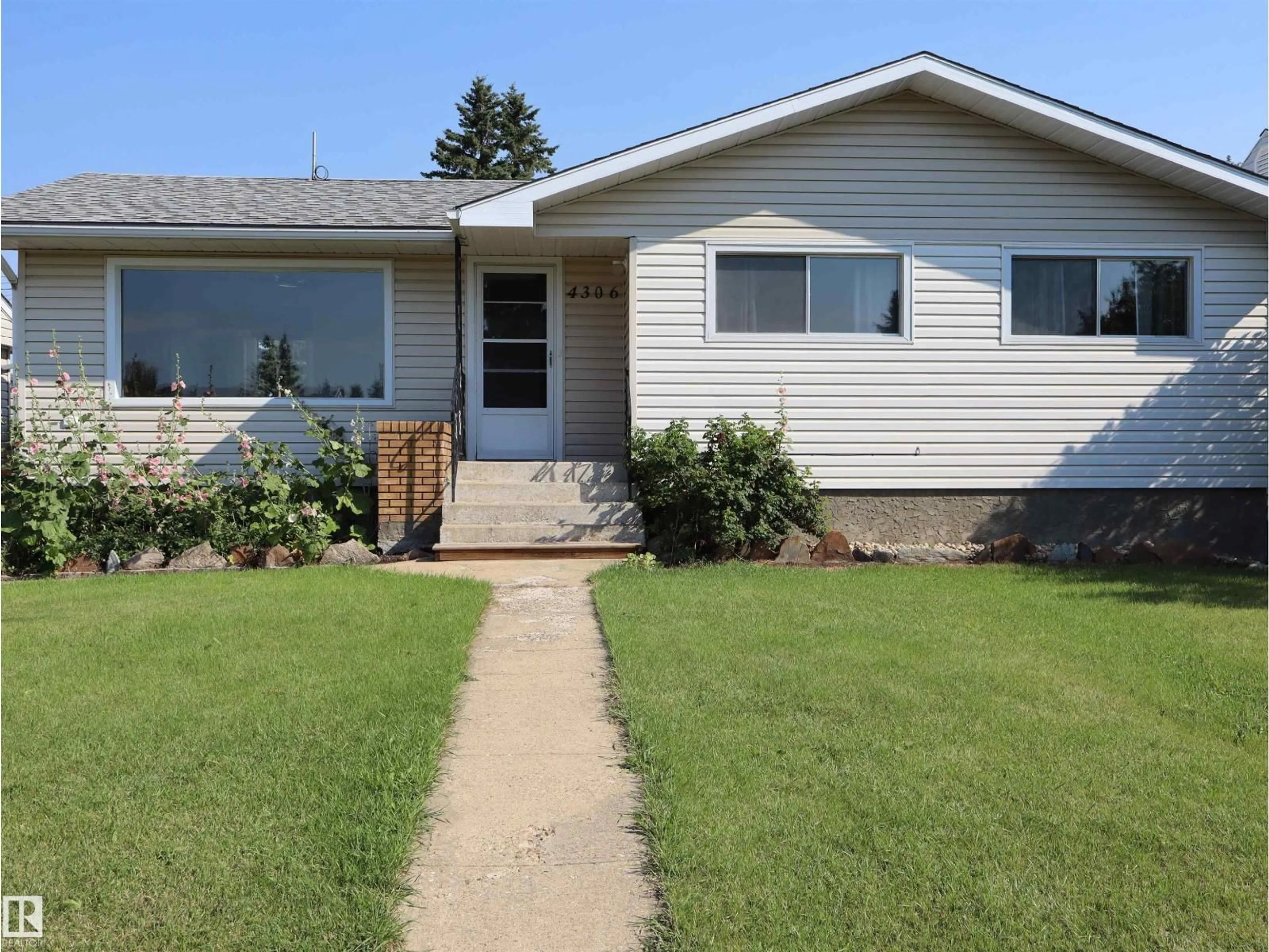 Home with vinyl exterior material, street for 4306 55 AVE, Barrhead Alberta T7N1K1