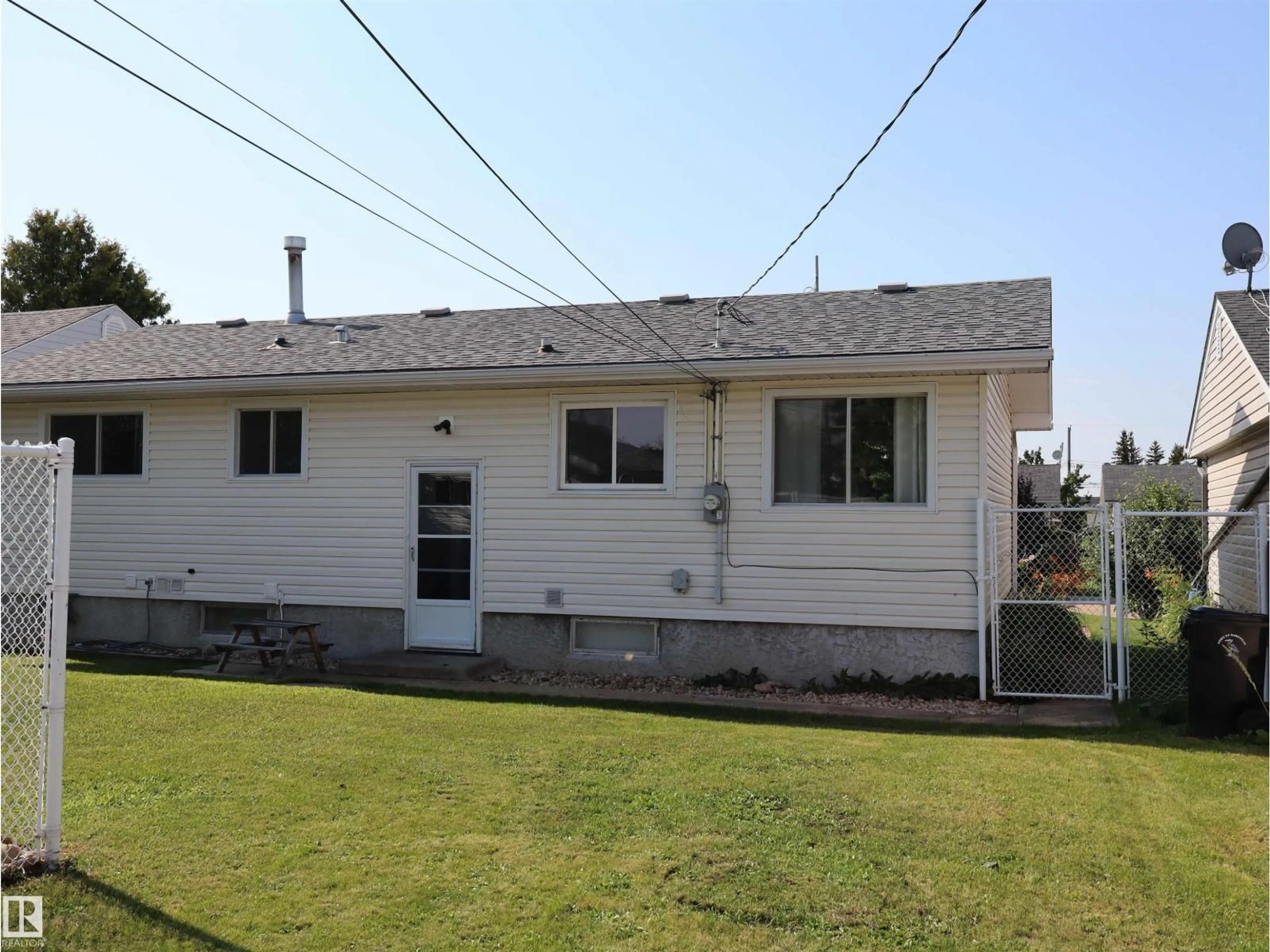 Home with vinyl exterior material, street for 4306 55 AVE, Barrhead Alberta T7N1K1