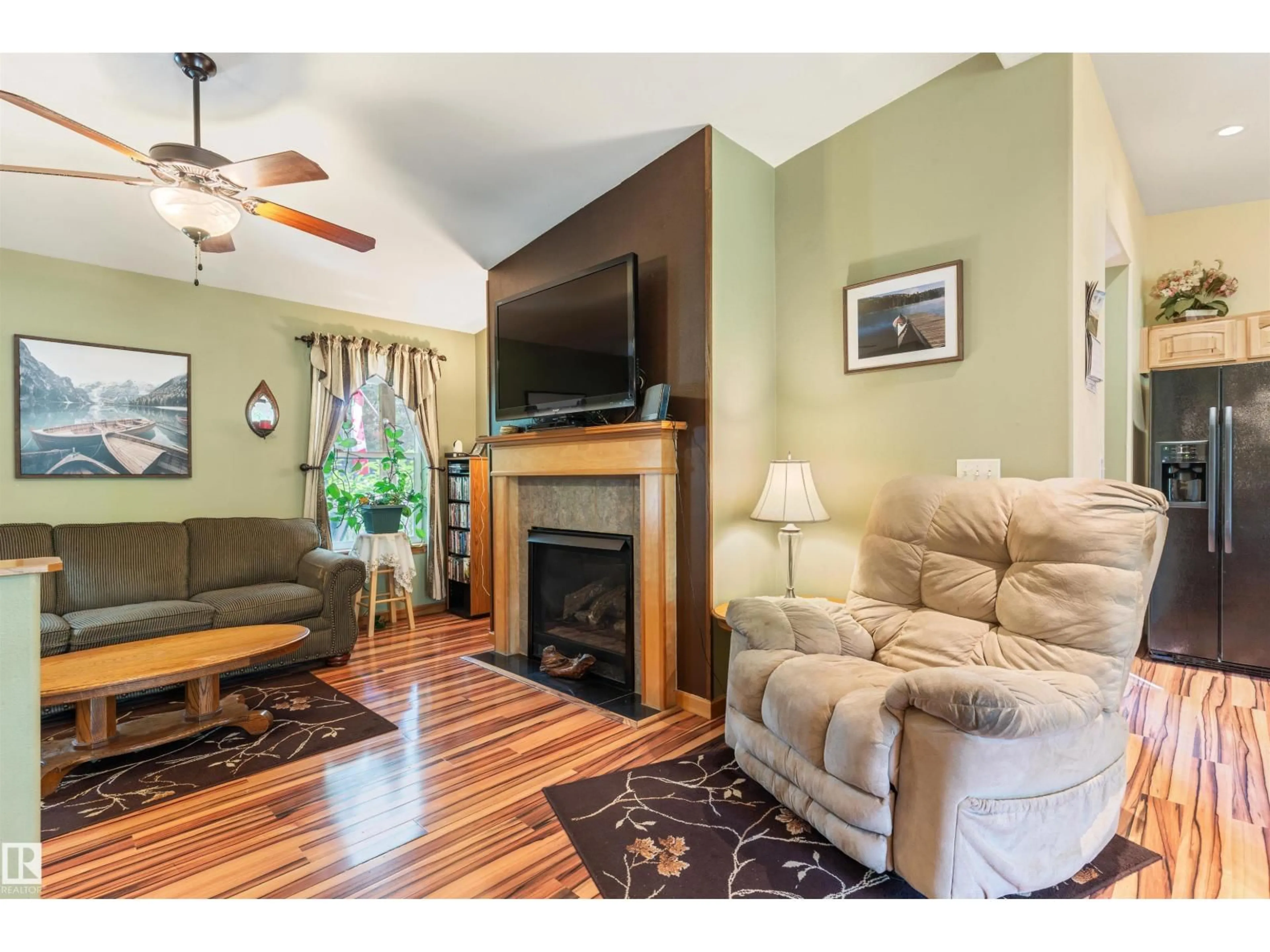 Living room with furniture, wood/laminate floor for 114 - 190019 TWP ROAD 653, Rural Athabasca County Alberta T0A0M0
