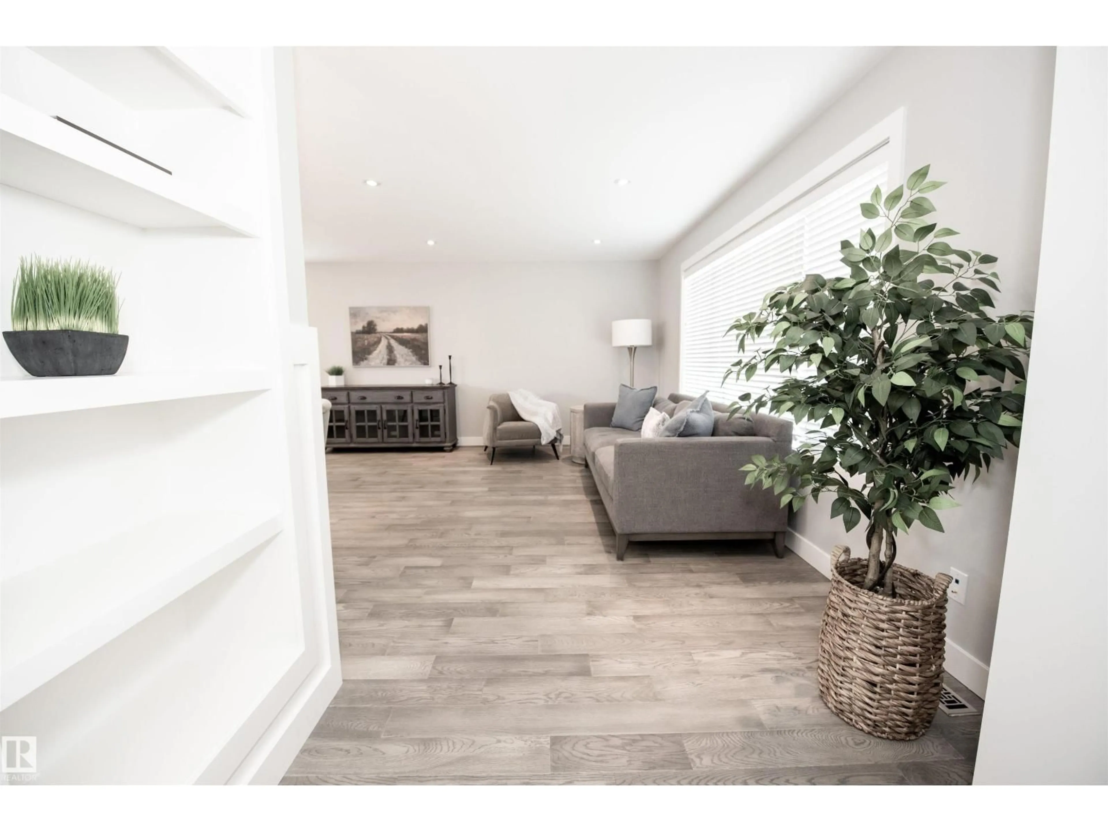 Living room with furniture, wood/laminate floor for NW - 12107 131 AV, Edmonton Alberta T5L3M7
