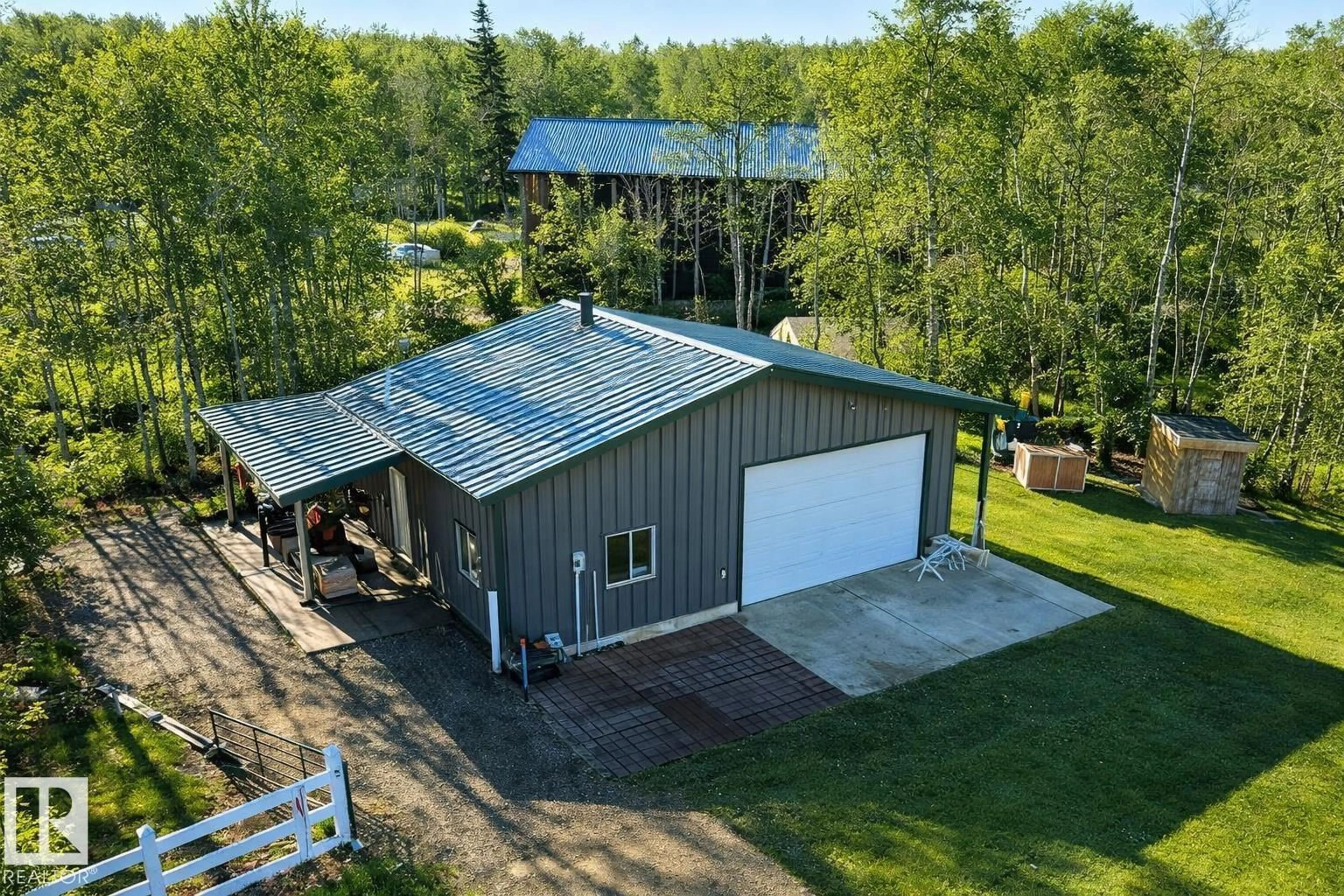 A pic from outside/outdoor area/front of a property/back of a property/a pic from drone, building for 120 50434 RGE RD 232, Rural Leduc County Alberta T4X0L1