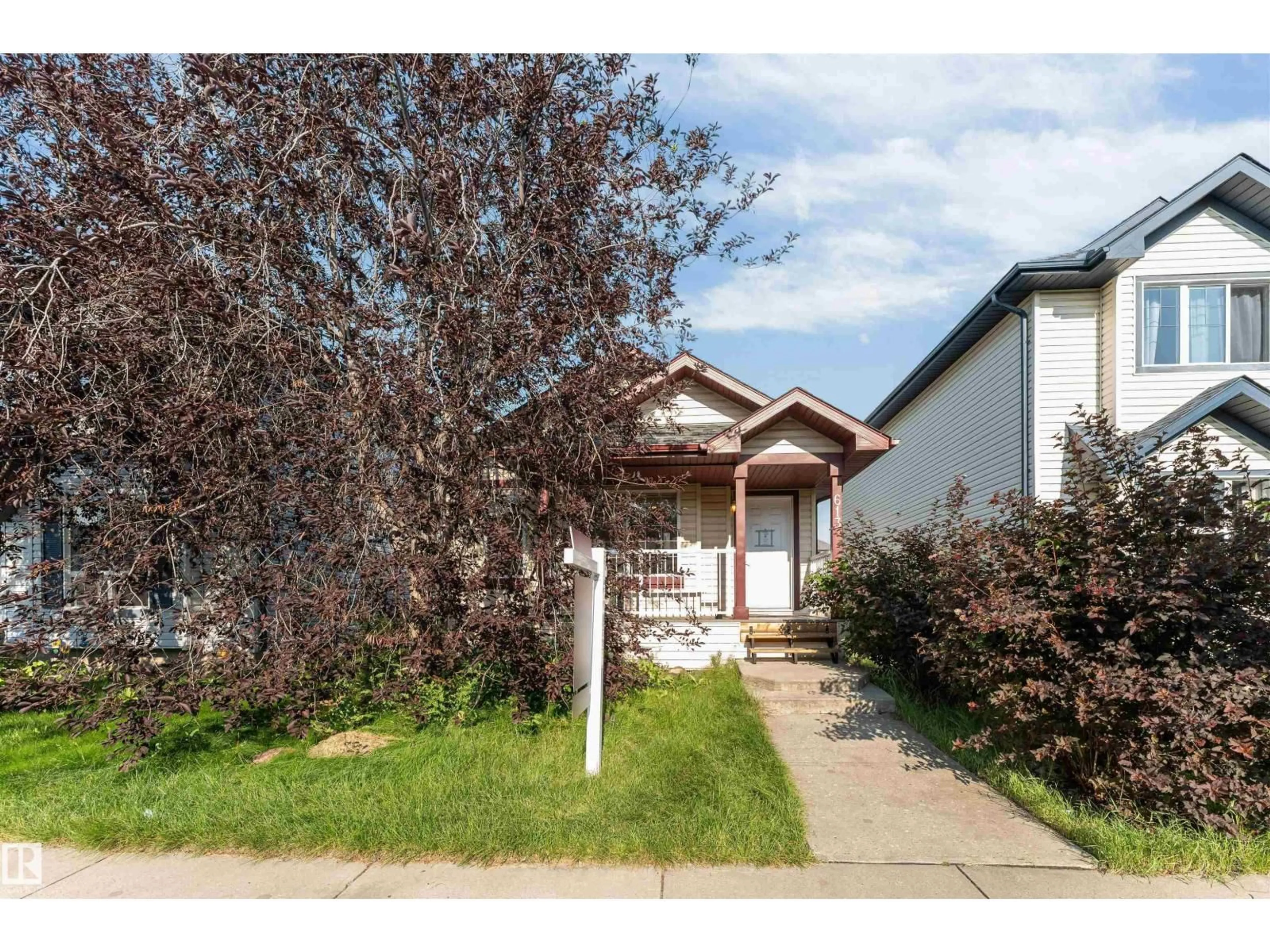 Home with vinyl exterior material, street for 613 83 ST, Edmonton Alberta T6X1L6