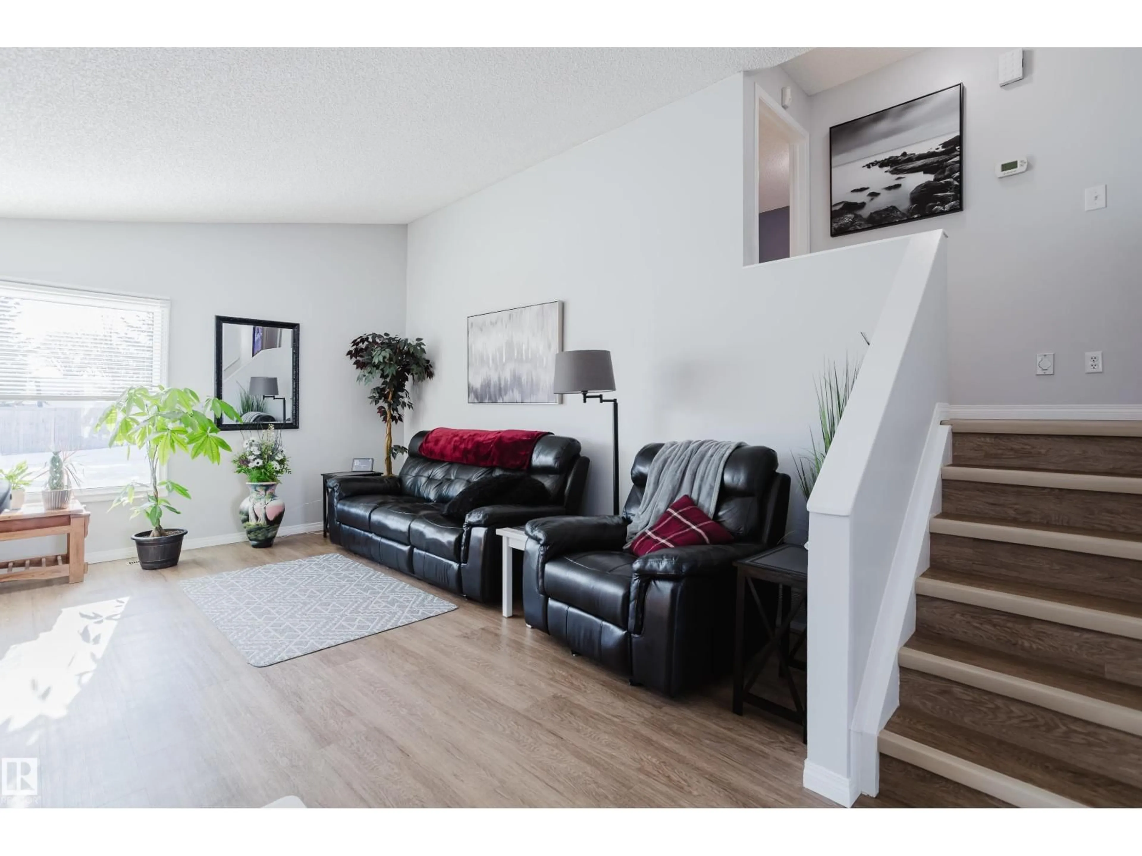 Living room with furniture, wood/laminate floor for 6 KINISKI CR, Edmonton Alberta T6L5A9