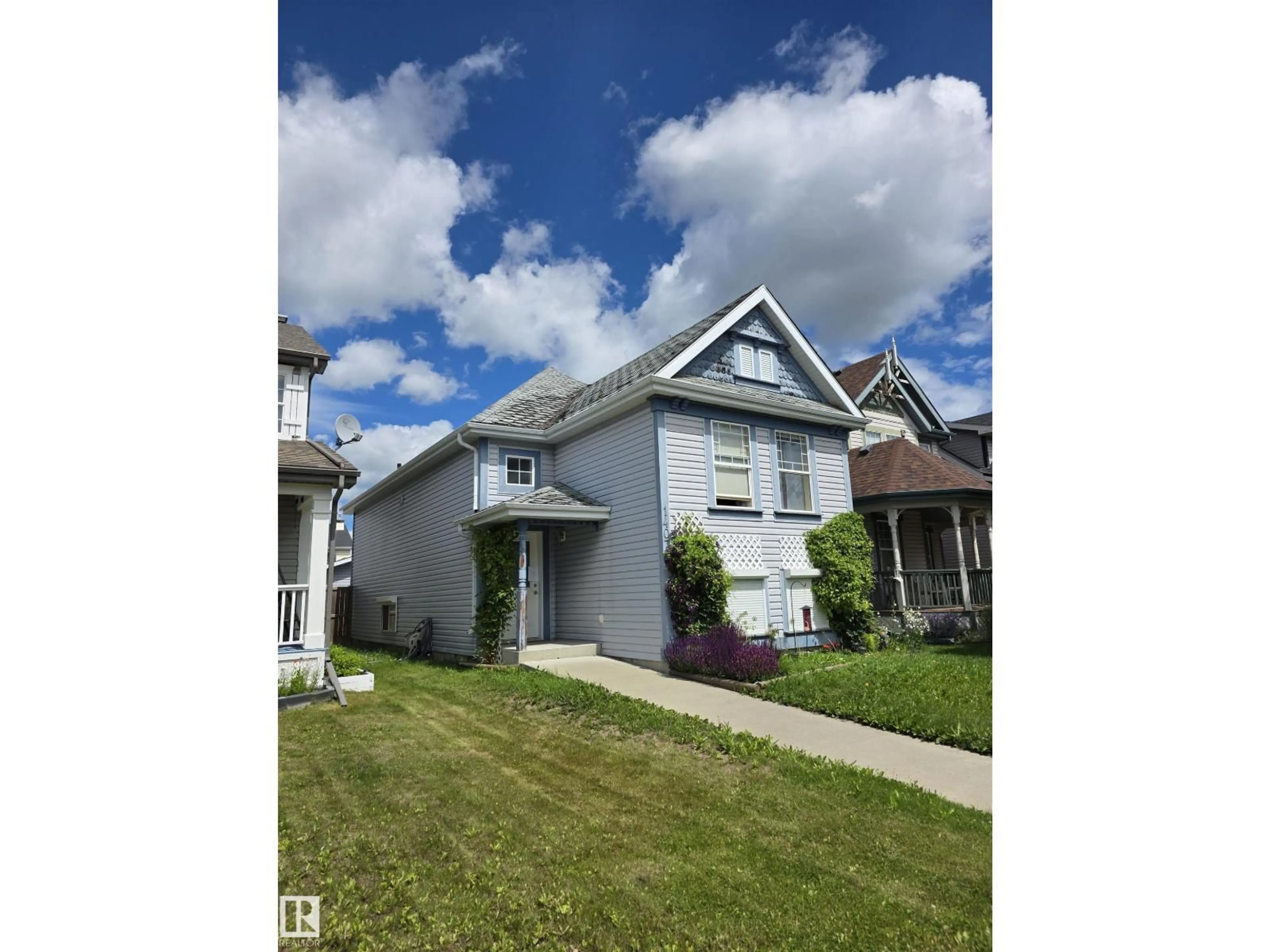 Home with vinyl exterior material, street for 14072 151 AV, Edmonton Alberta T6V1V1