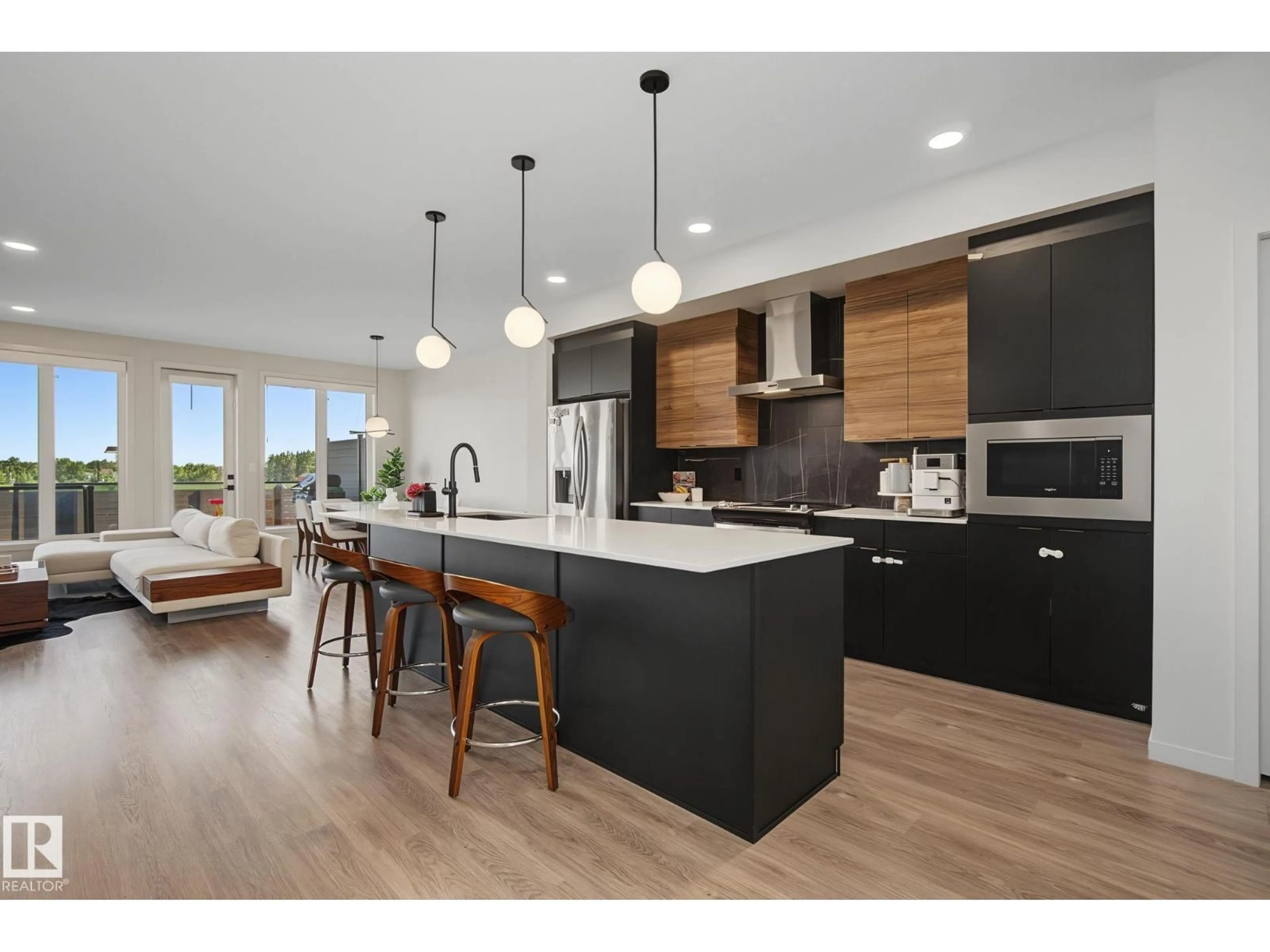 Open concept kitchen, wood/laminate floor for 3313 KULAY WY, Edmonton Alberta T6W5E7