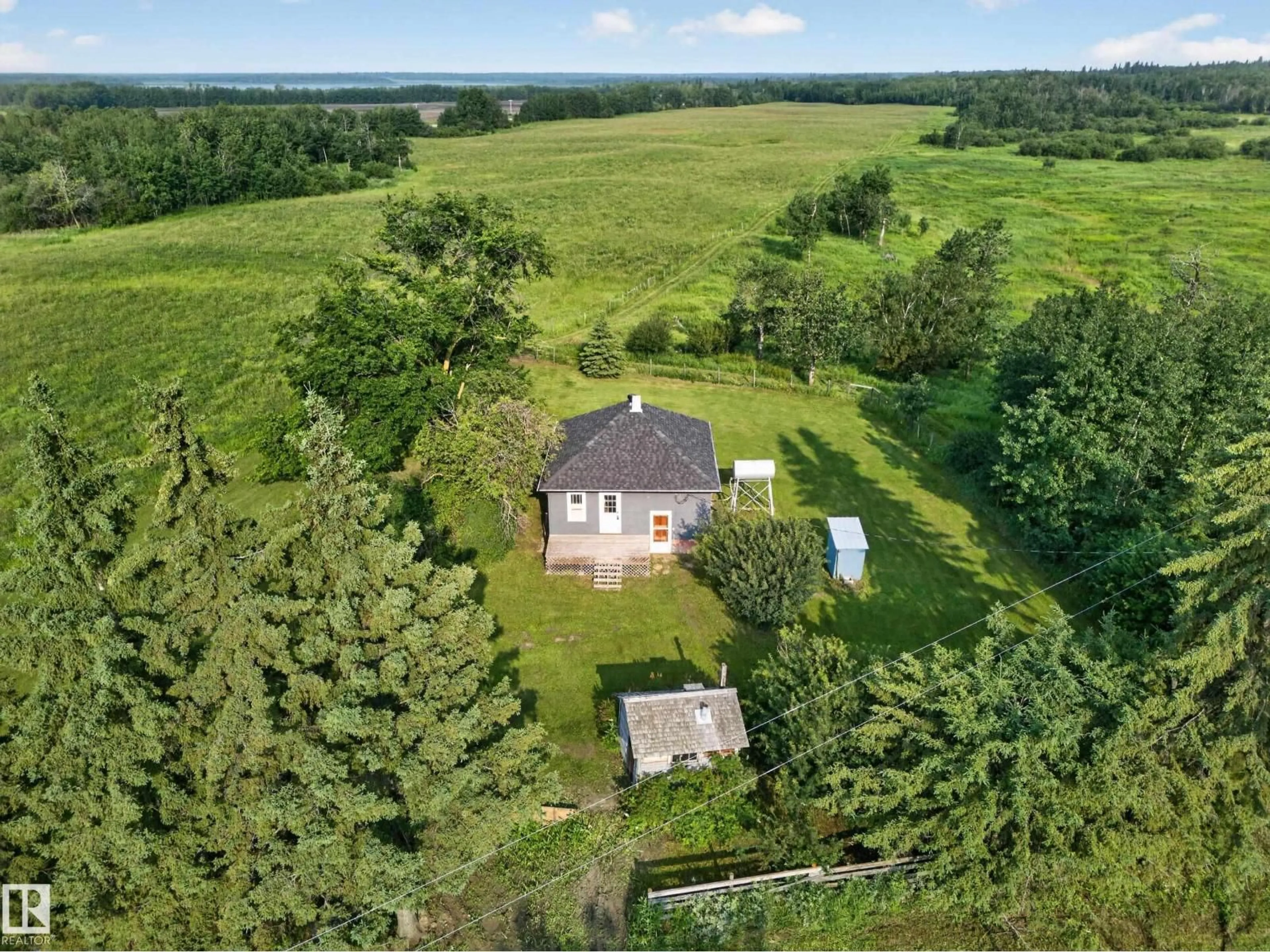 A pic from outside/outdoor area/front of a property/back of a property/a pic from drone, unknown for 52020 RR 205, Rural Strathcona County Alberta T8G1G3
