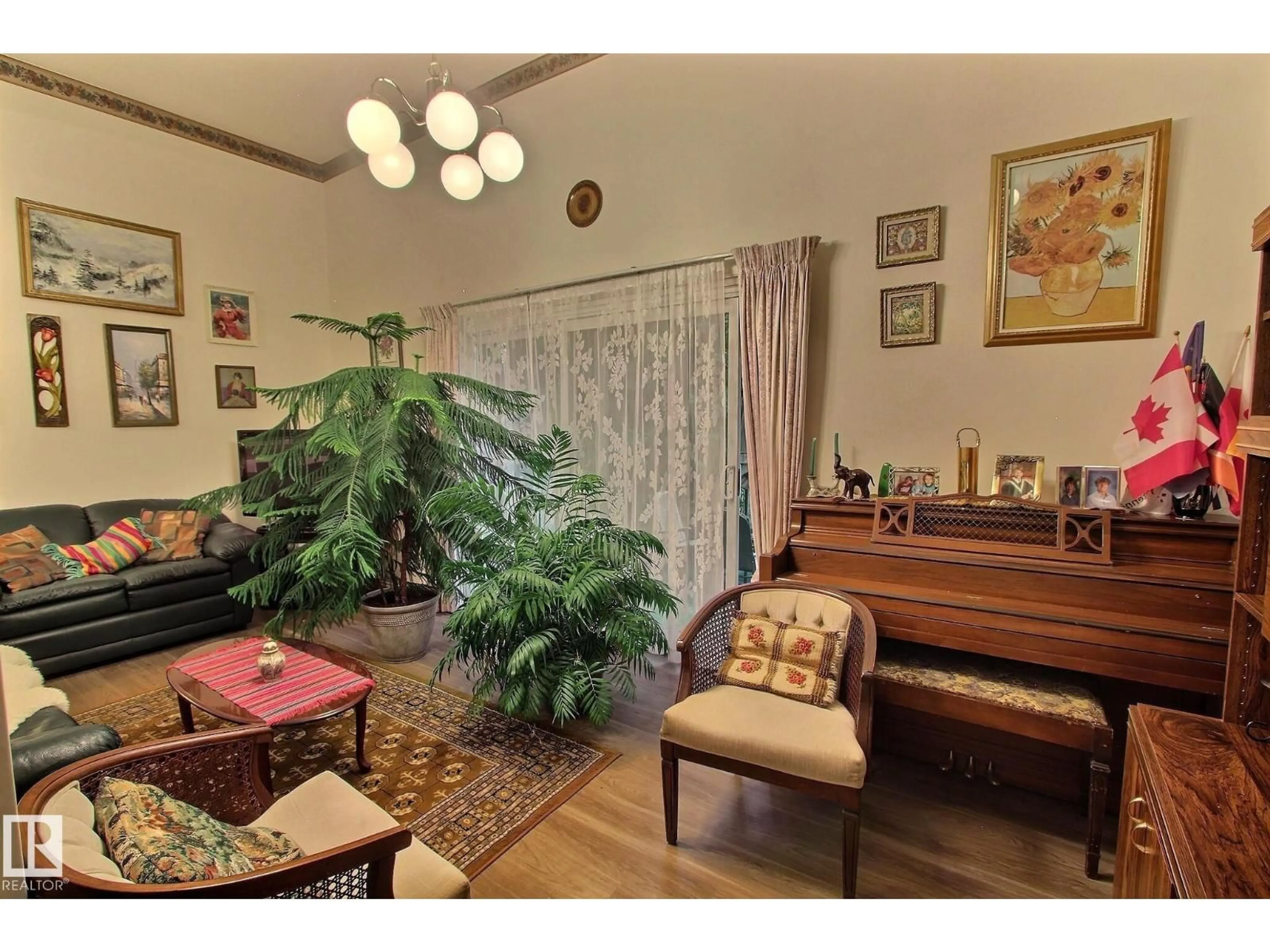 Living room with furniture, wood/laminate floor for 14626 52 ST, Edmonton Alberta T5A3M7