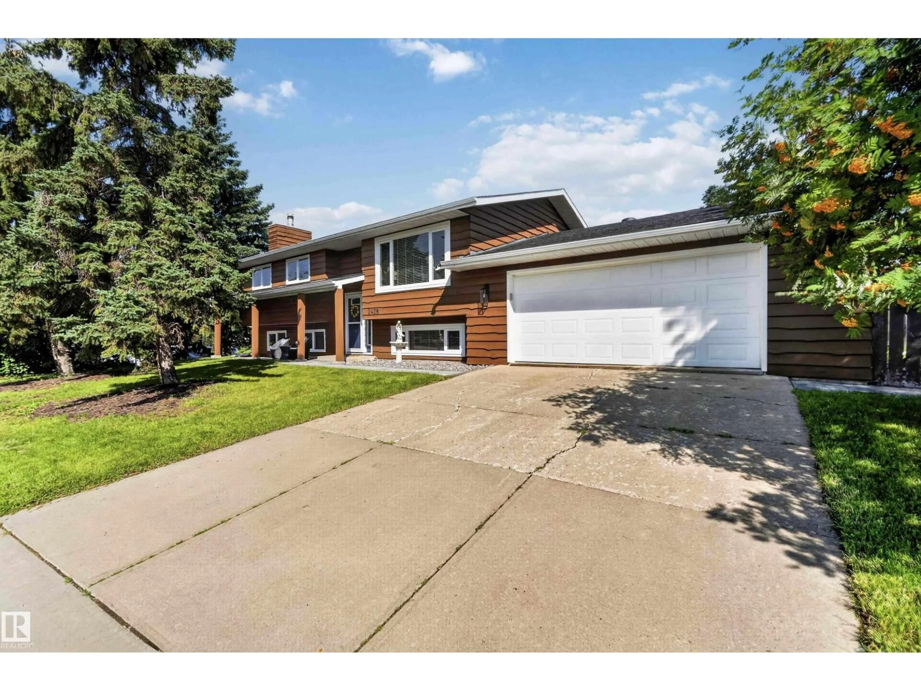 Home with brick exterior material, street for 2428 142 AV, Edmonton Alberta T5Y1R2