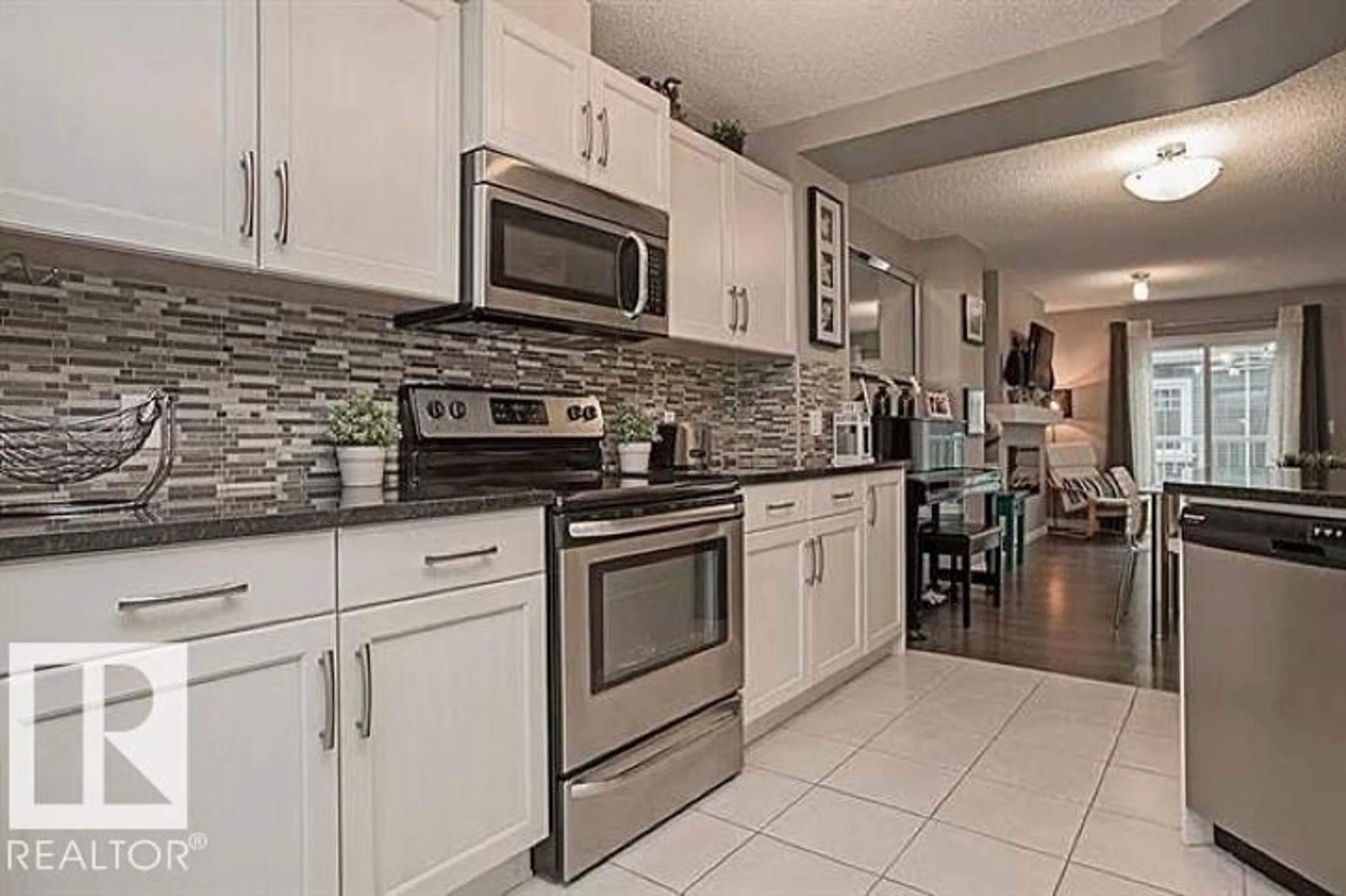 Open concept kitchen, ceramic/tile floor for #95 - 4050 SAVARYN DR, Edmonton Alberta T6X1R8