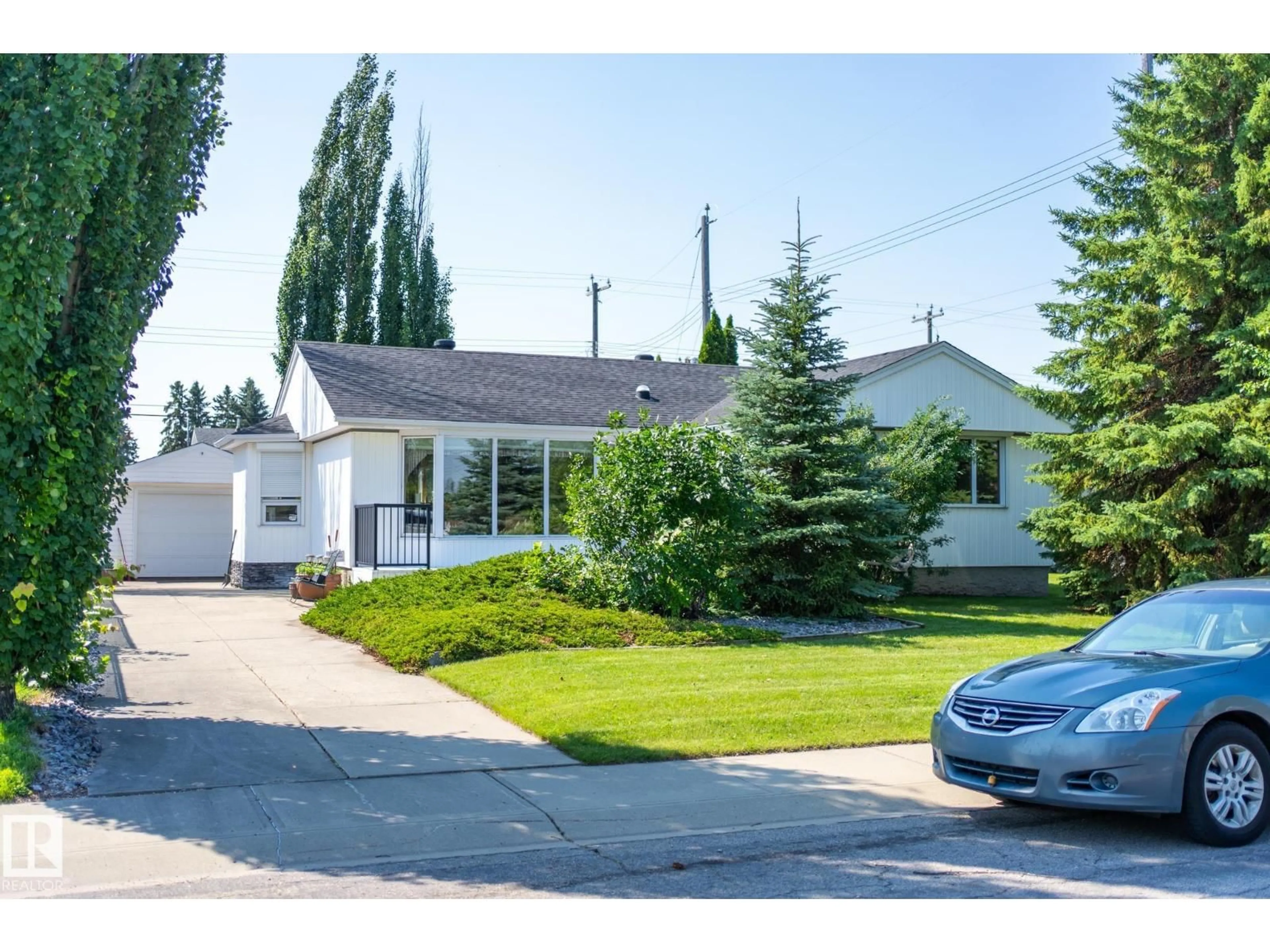 A pic from outside/outdoor area/front of a property/back of a property/a pic from drone, street for 4707 105A AV, Edmonton Alberta T6A1C1