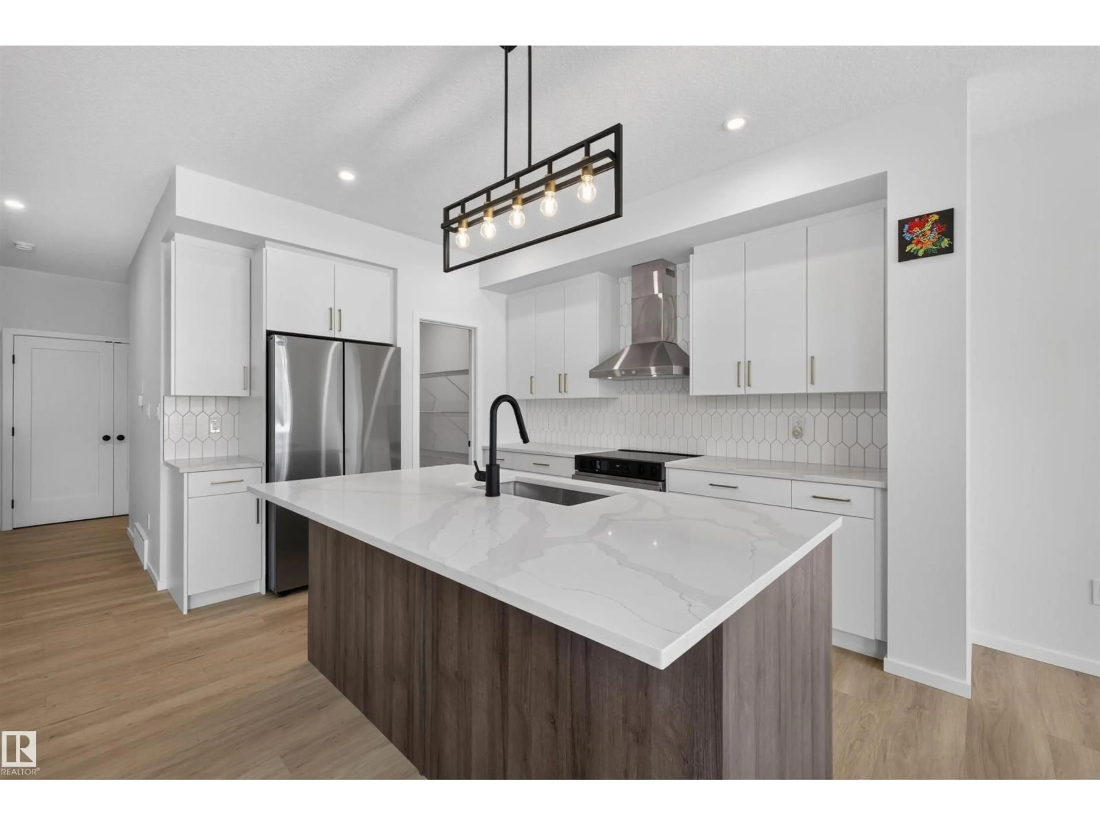 Open concept kitchen, ceramic/tile floor for 7722 174A AV, Edmonton Alberta T5Z0W5