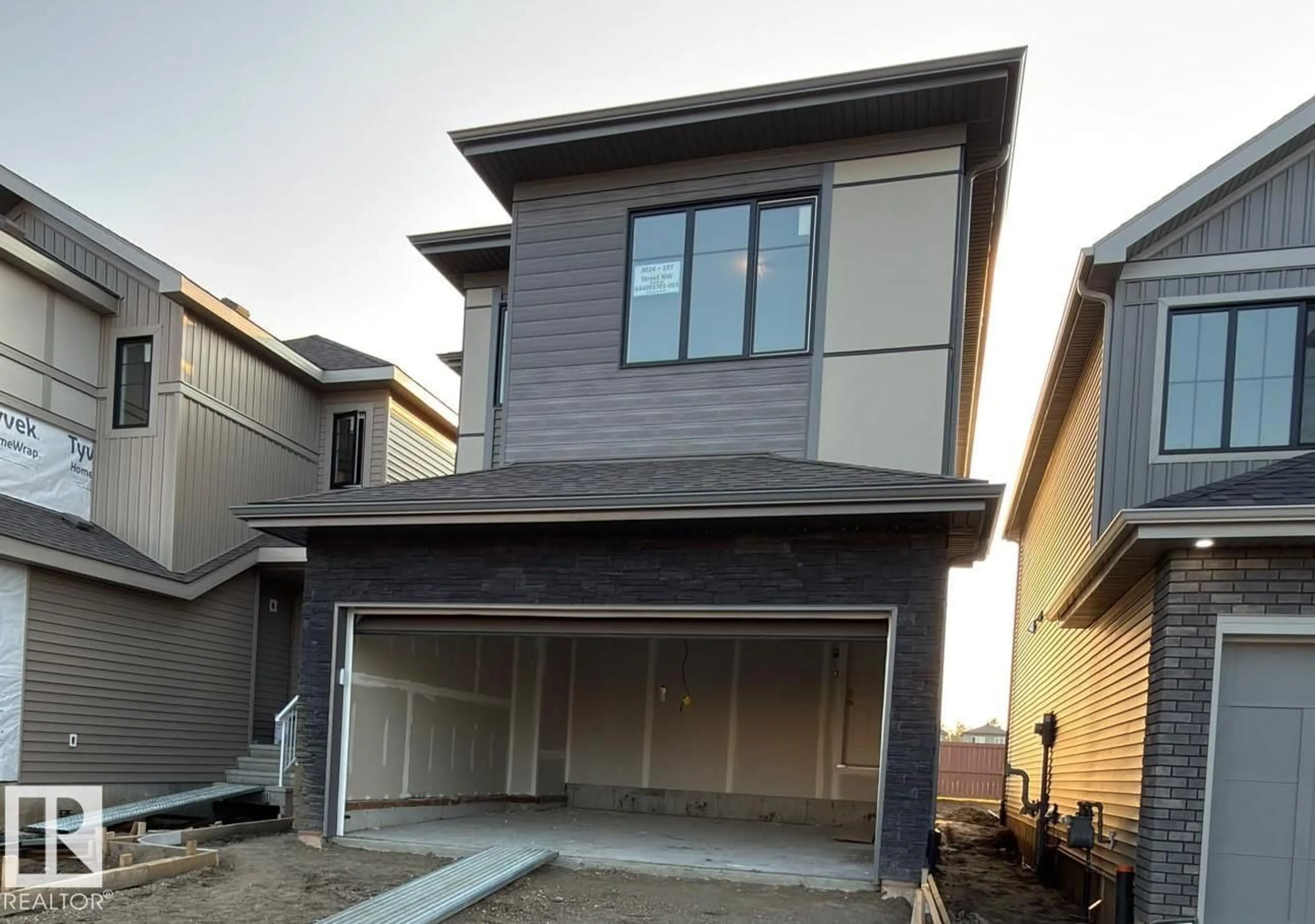 Home with vinyl exterior material, street for NW - 3024 197 ST, Edmonton Alberta T6M3L9