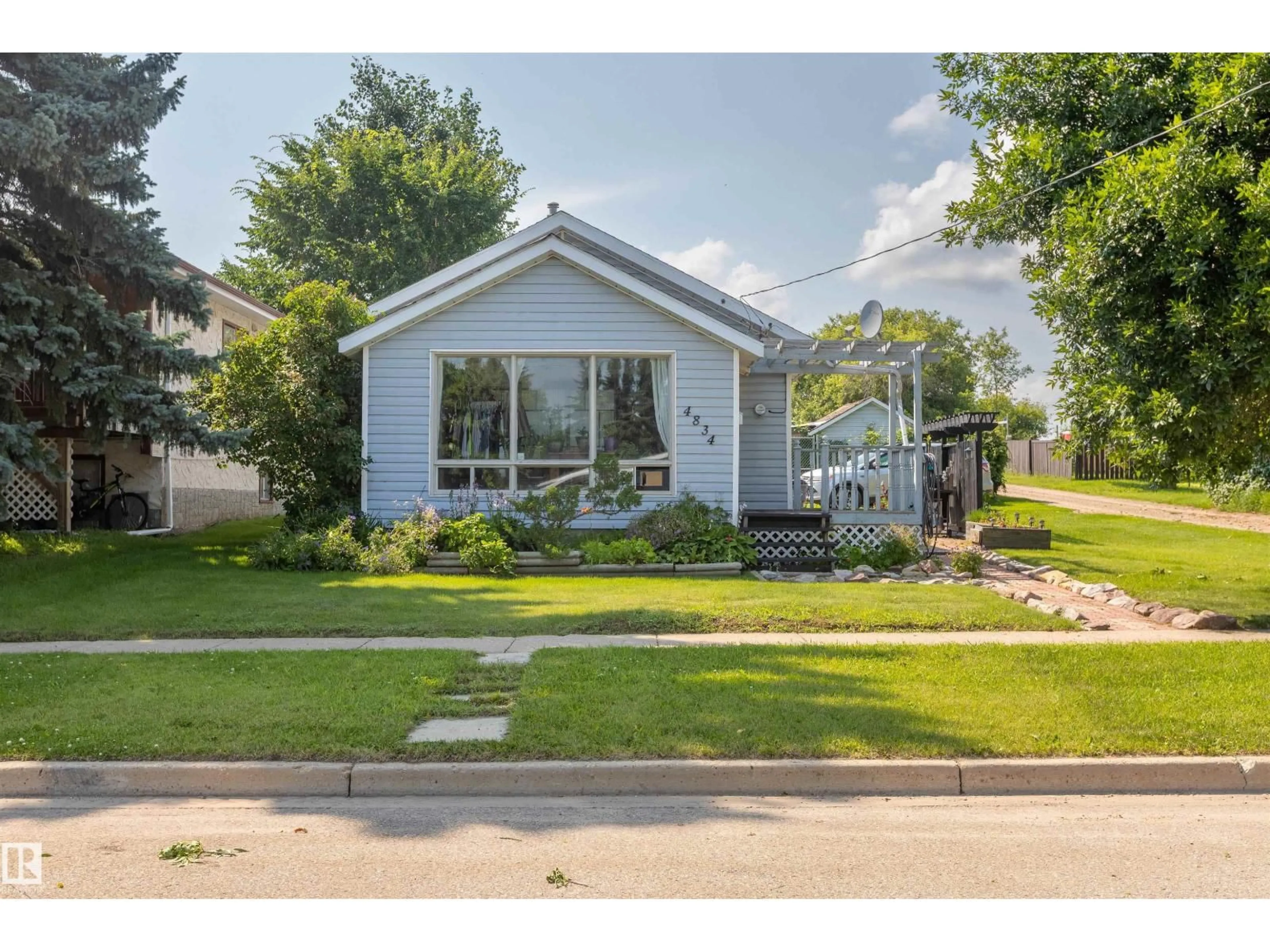 Home with vinyl exterior material, street for 4834 51 ST, Legal Alberta T0G1L0