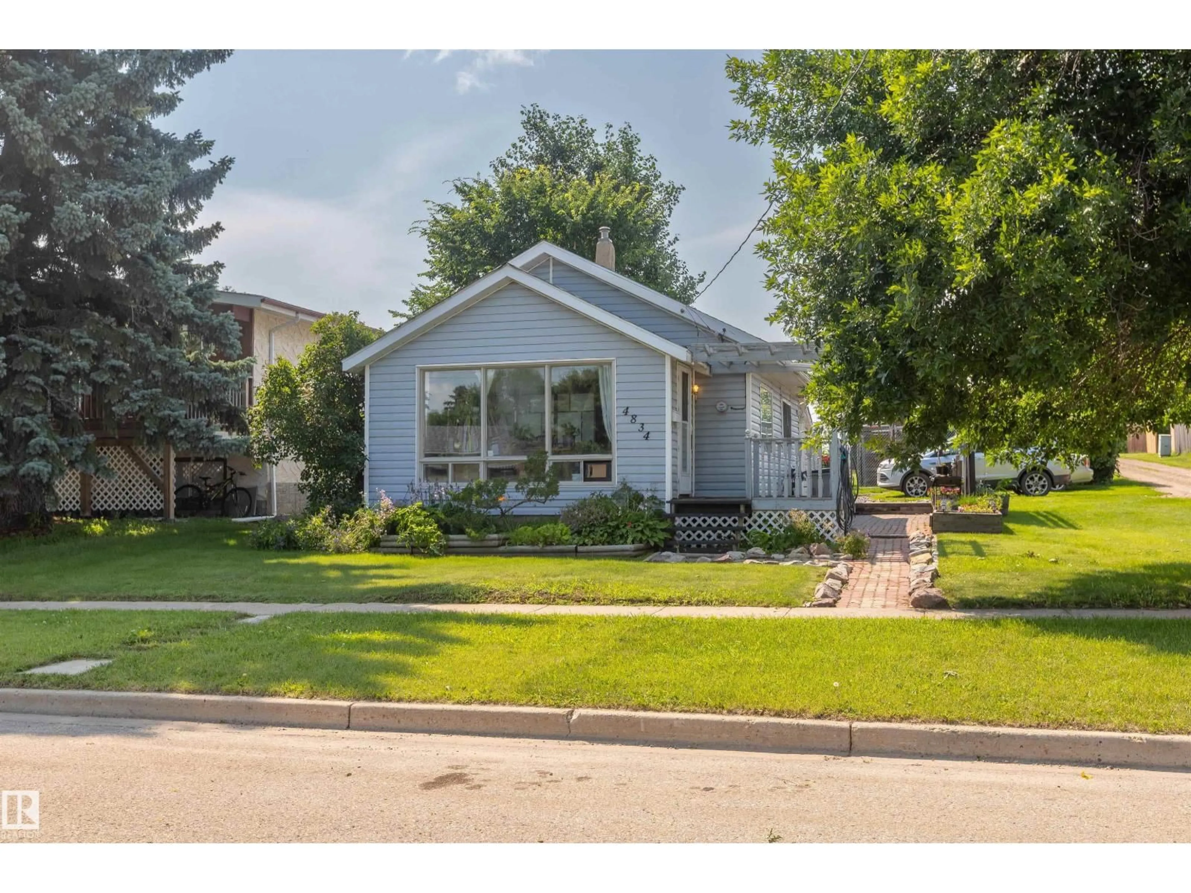 Home with vinyl exterior material, street for 4834 51 ST, Legal Alberta T0G1L0