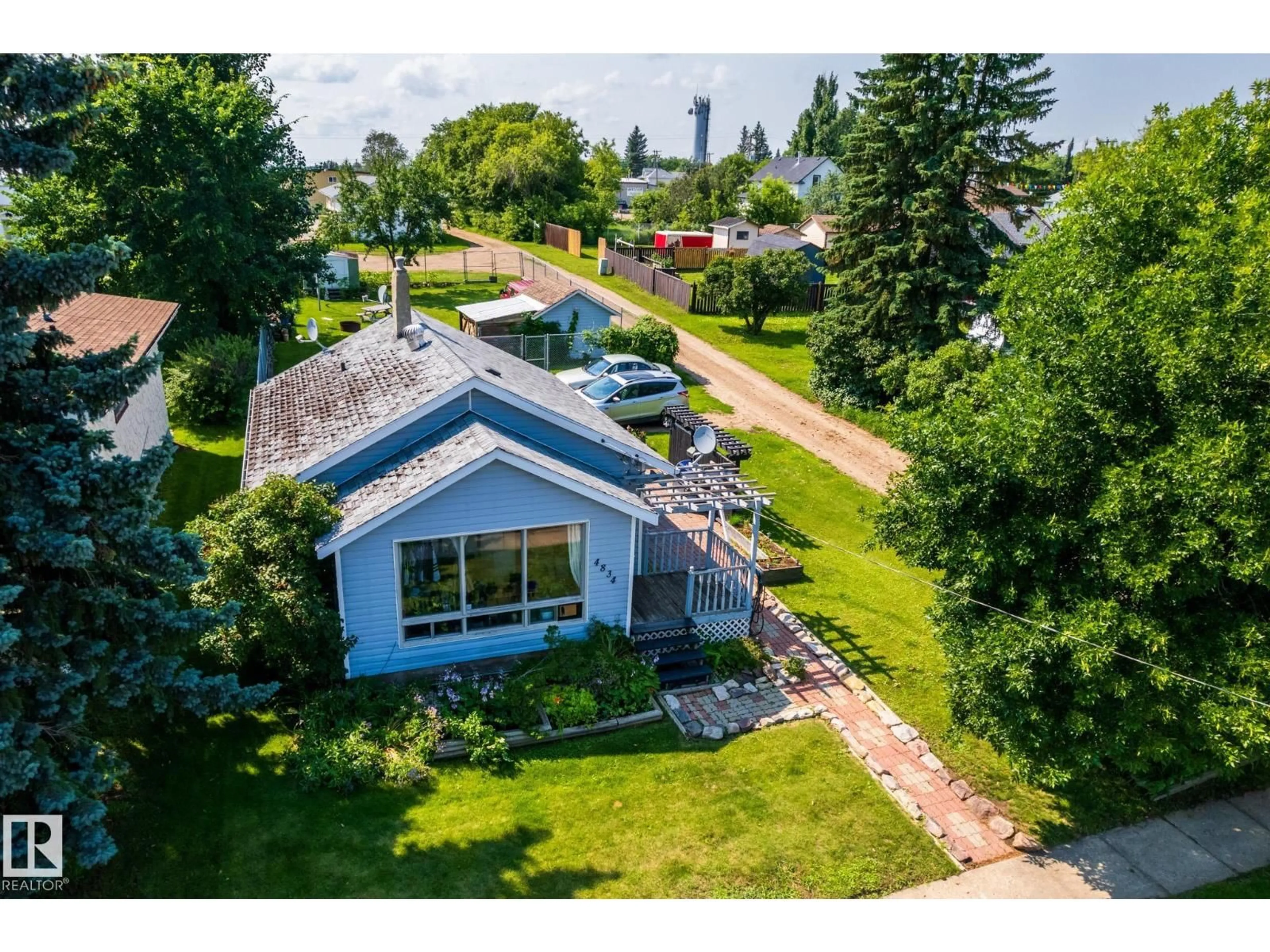 A pic from outside/outdoor area/front of a property/back of a property/a pic from drone, water/lake/river/ocean view for 4834 51 ST, Legal Alberta T0G1L0