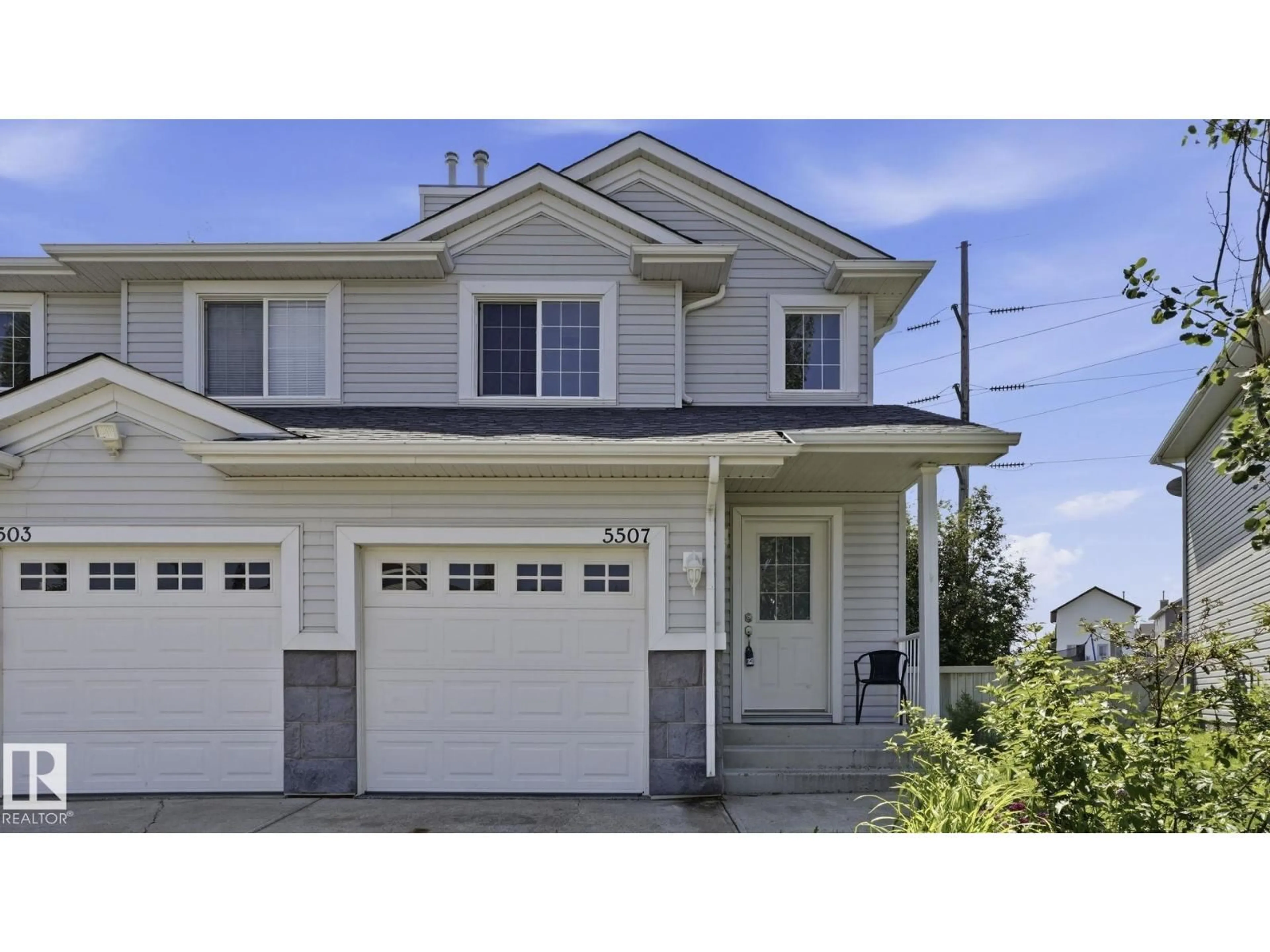 Home with vinyl exterior material, street for 5507 163 AV, Edmonton Alberta T5Y3L2