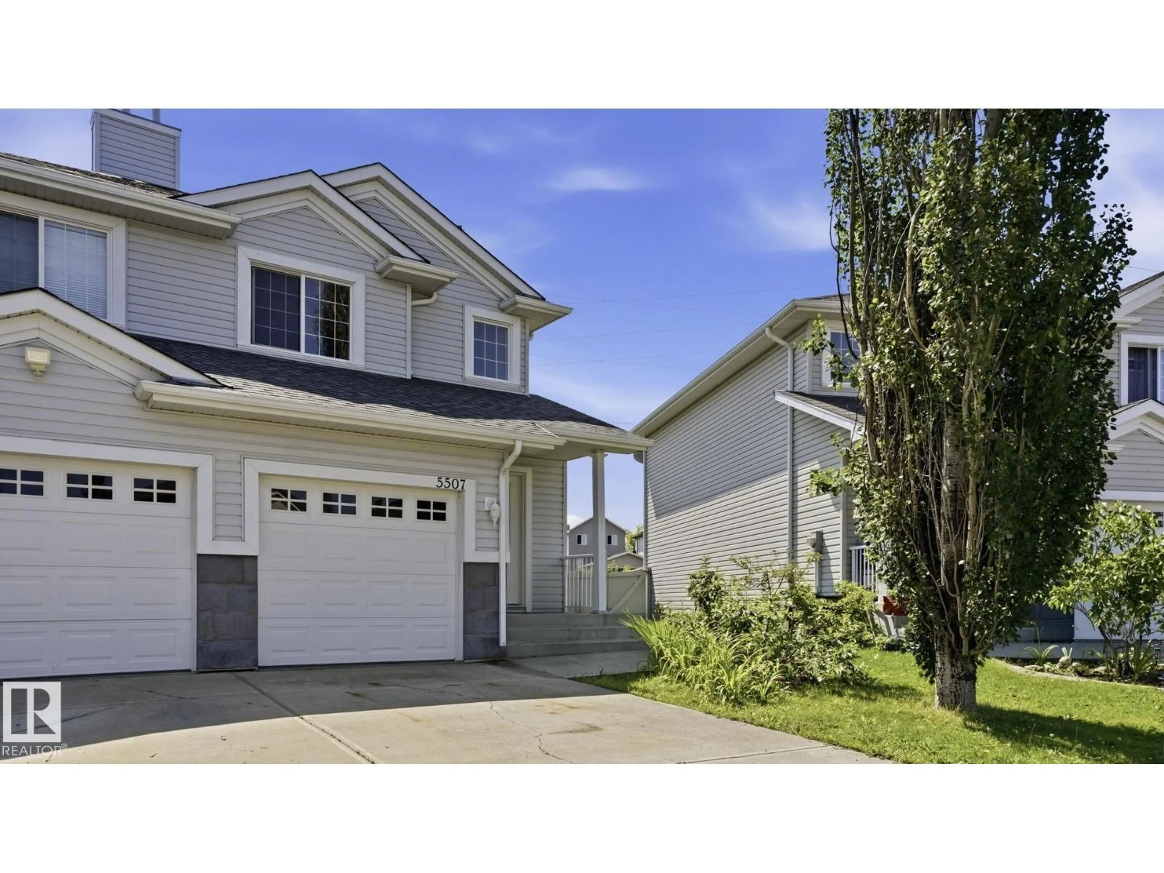 Home with vinyl exterior material, street for 5507 163 AV, Edmonton Alberta T5Y3L2