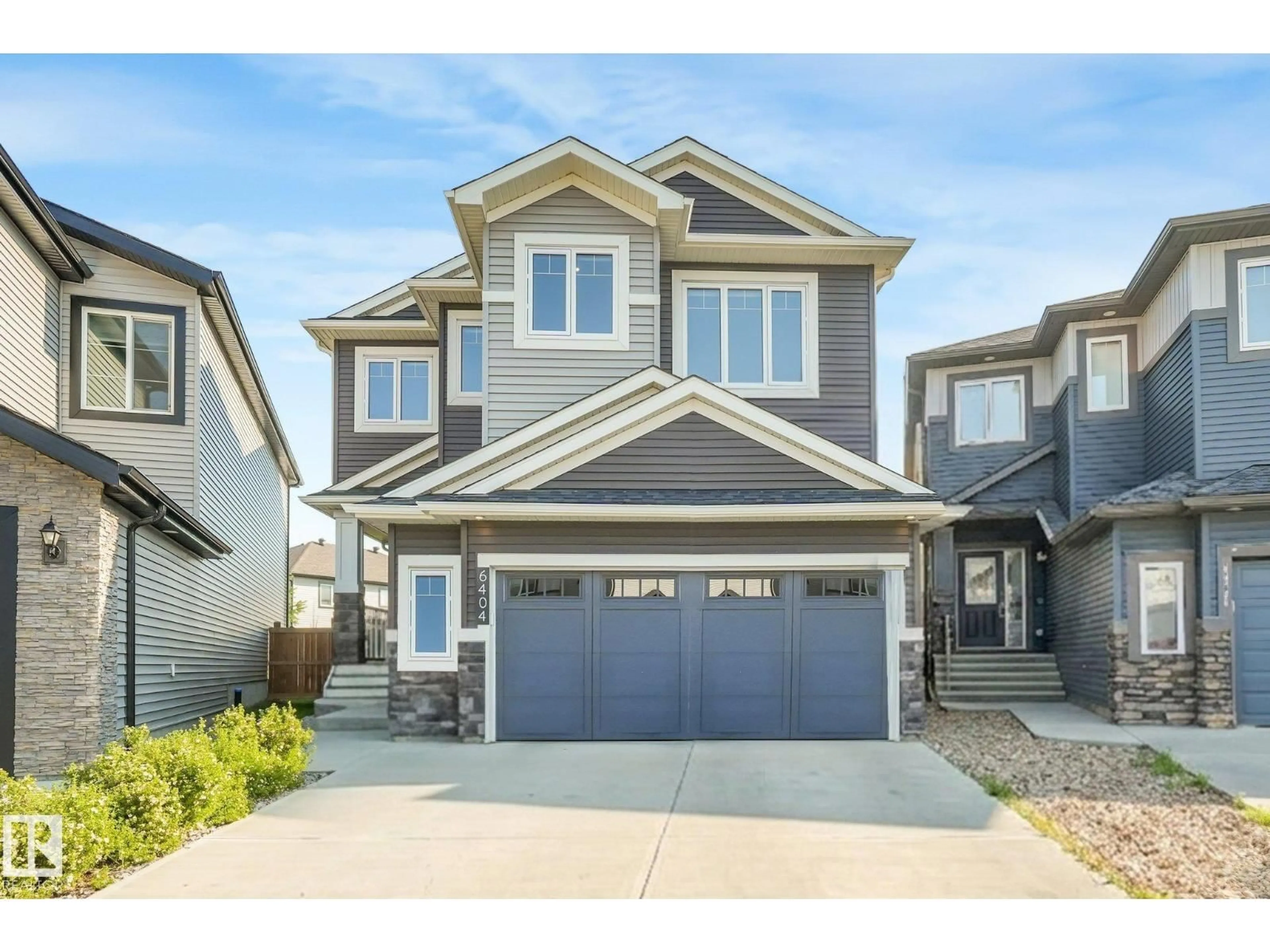 Home with vinyl exterior material, street for 6404 176 AV, Edmonton Alberta T5Y4A9