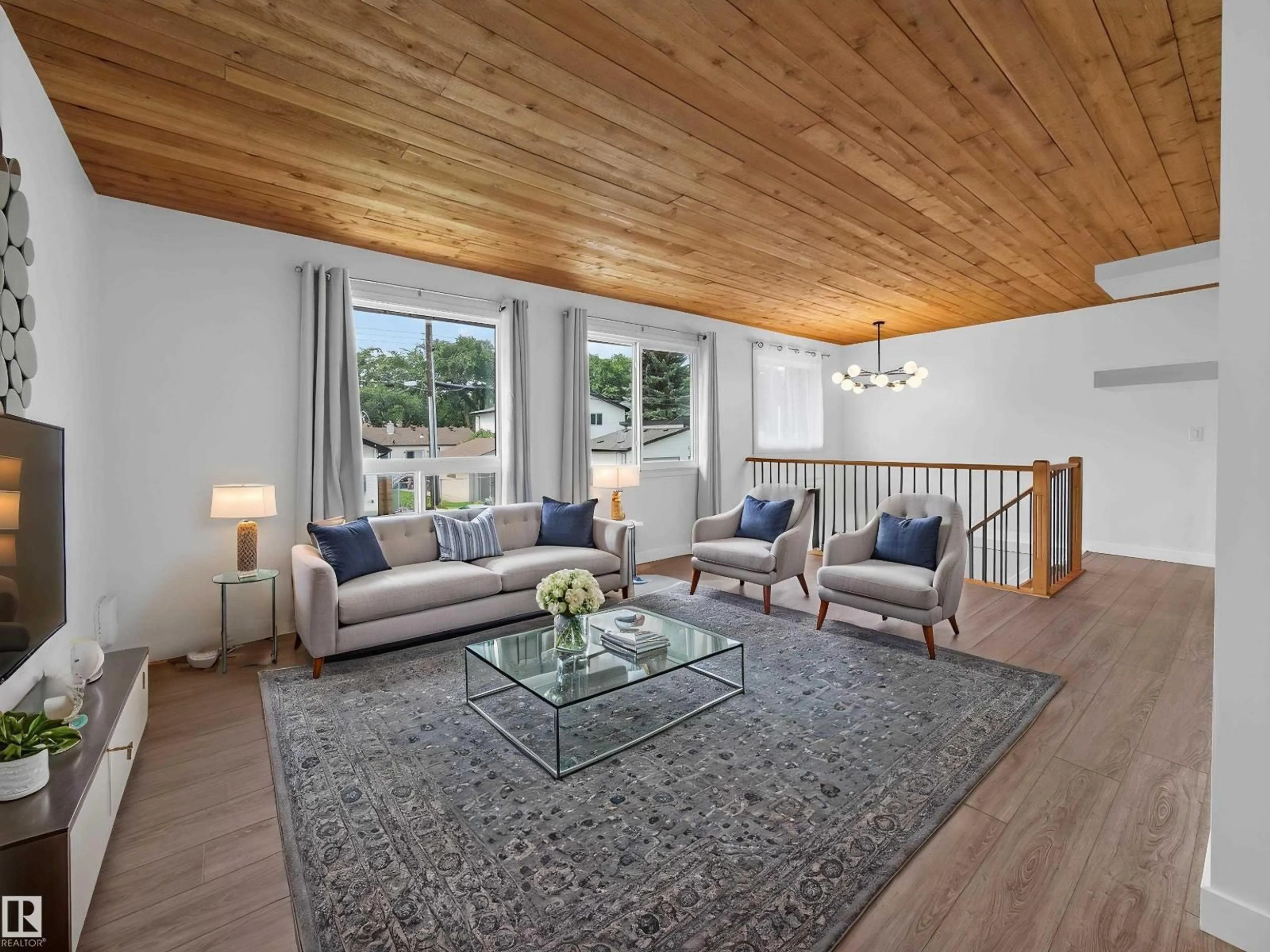 Living room with furniture, wood/laminate floor for NW - 10136 81 ST, Edmonton Alberta T6A3K5