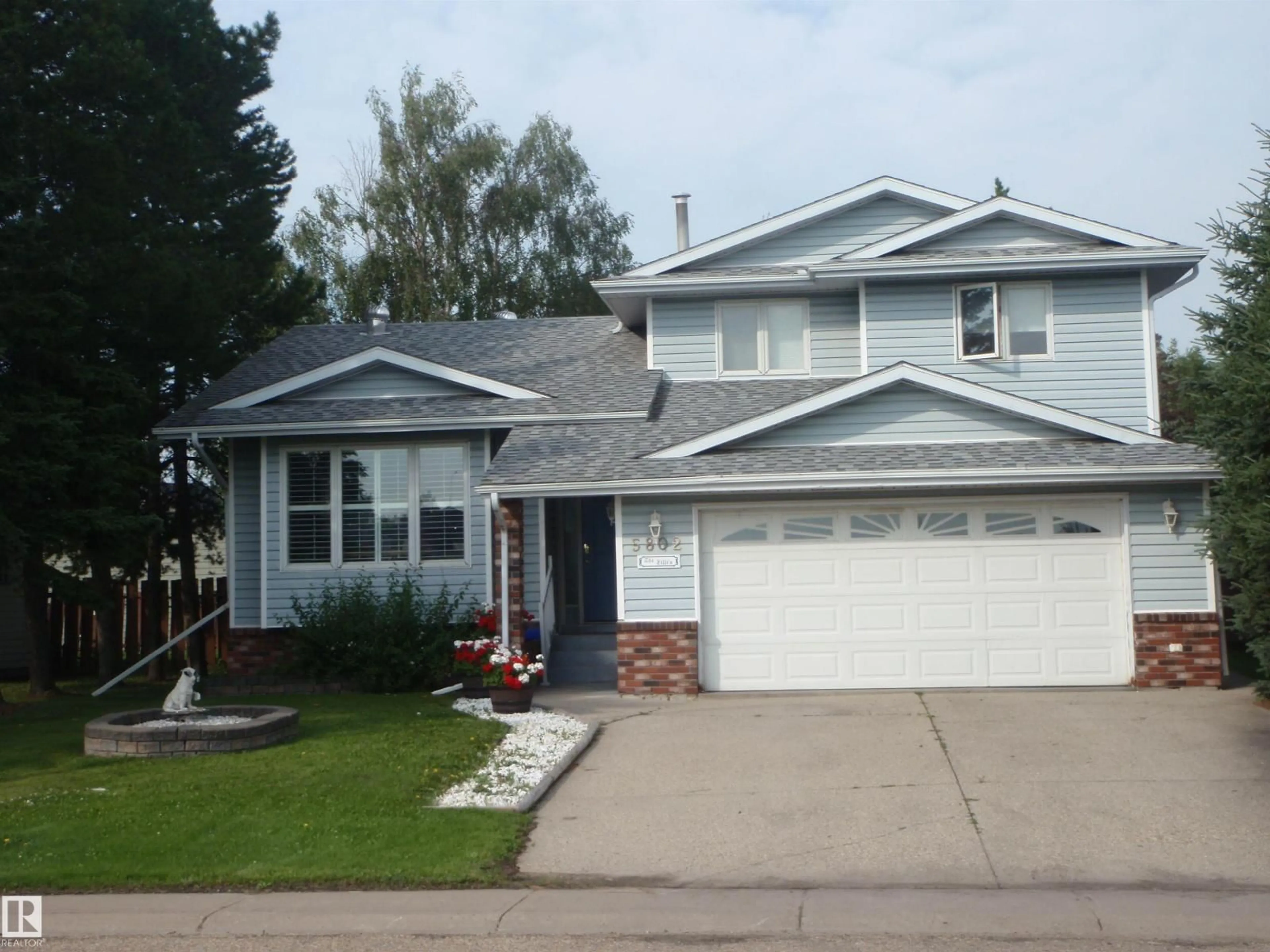 Home with vinyl exterior material, street for 5802 53 ST, Barrhead Alberta T7N1N1