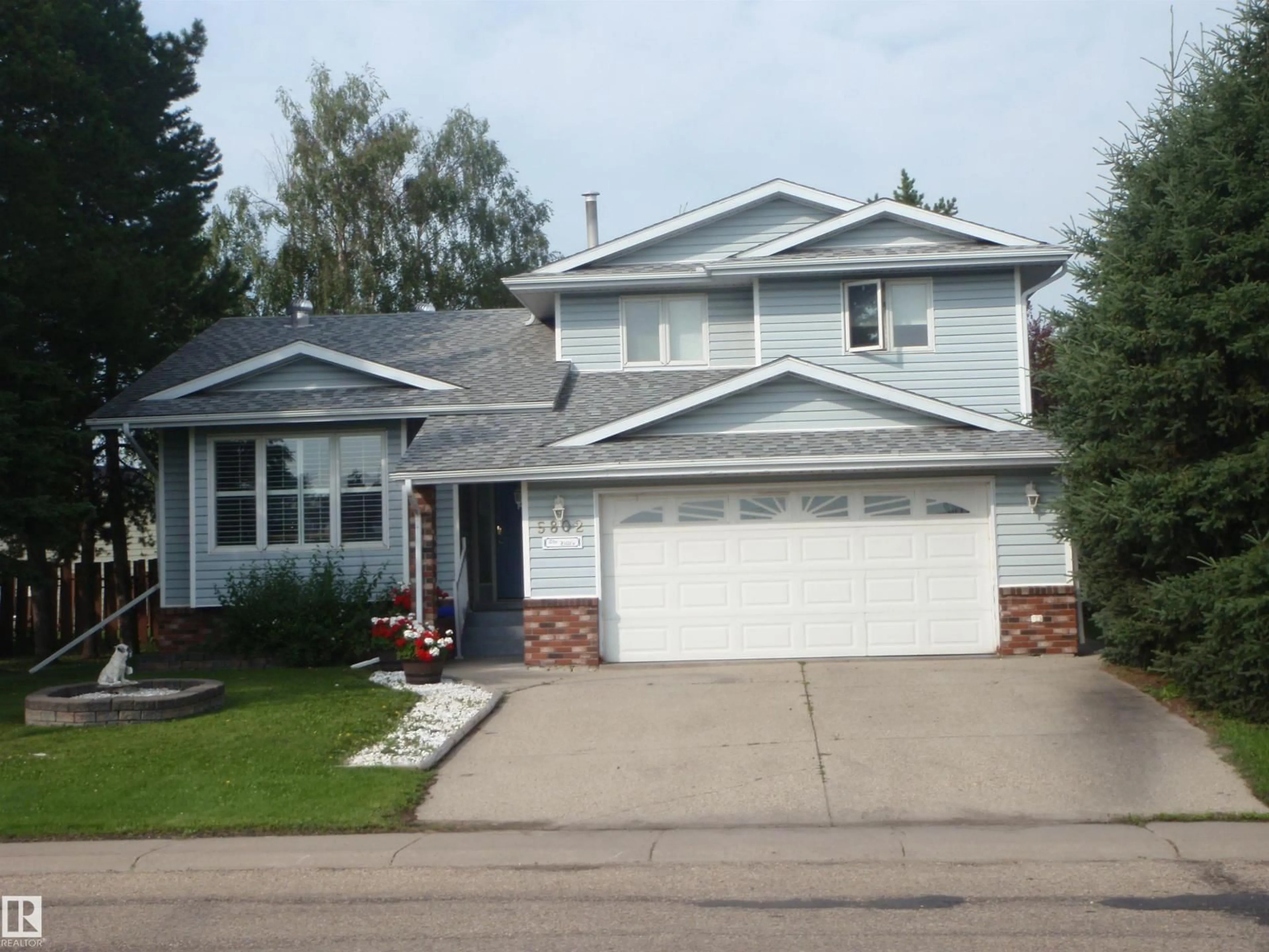 Home with vinyl exterior material, street for 5802 53 ST, Barrhead Alberta T7N1N1